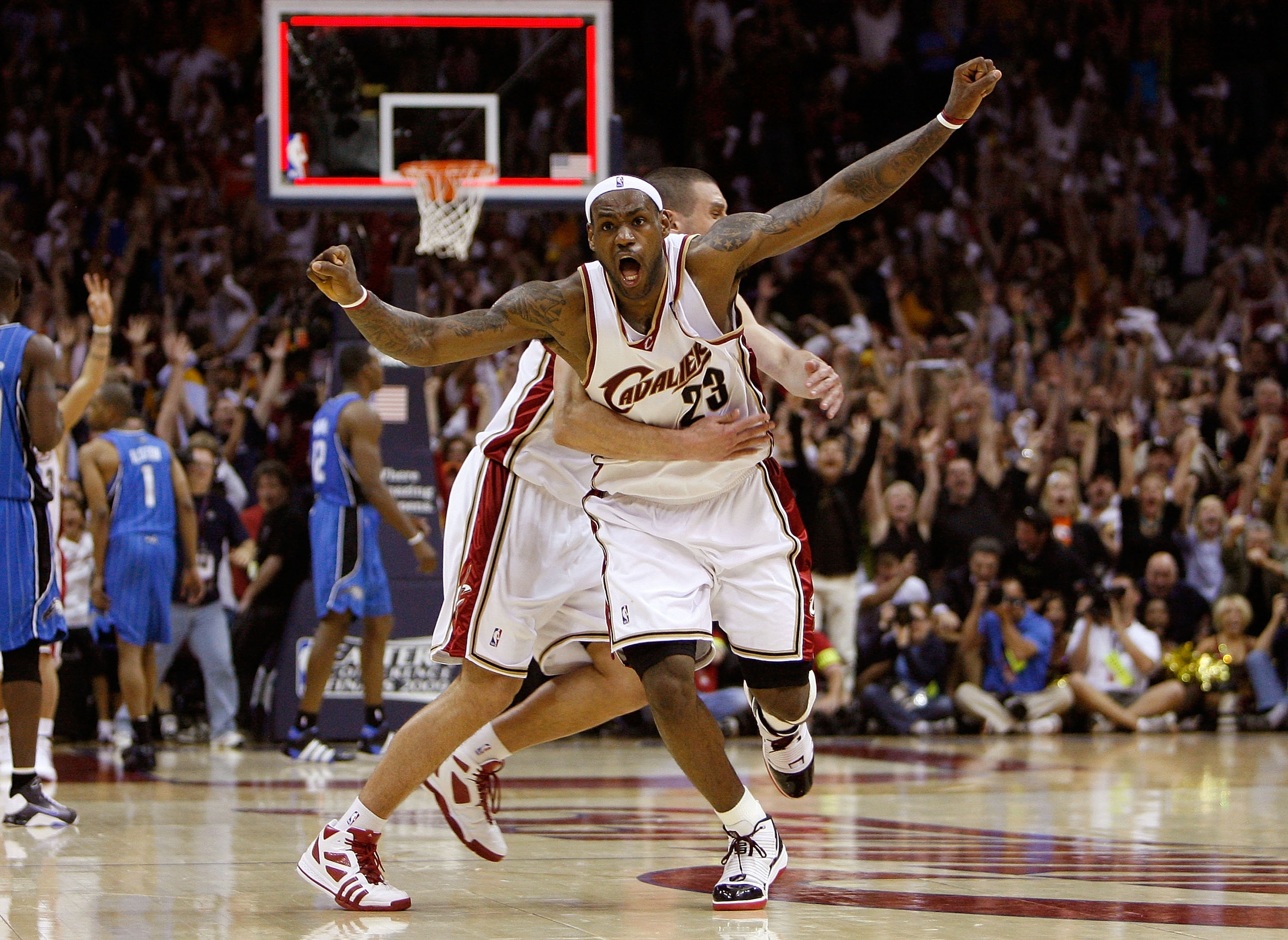 CLEVELAND - MAY 22: LeBron James #23 and Sasha Pavlovic #3 of the Cleveland Cavaliers celebrate after James made the game winning three pointer against the Orlando Magic in Game Two of the Eastern Conference Finals during the 2009 Playoffs at Quicken Loan