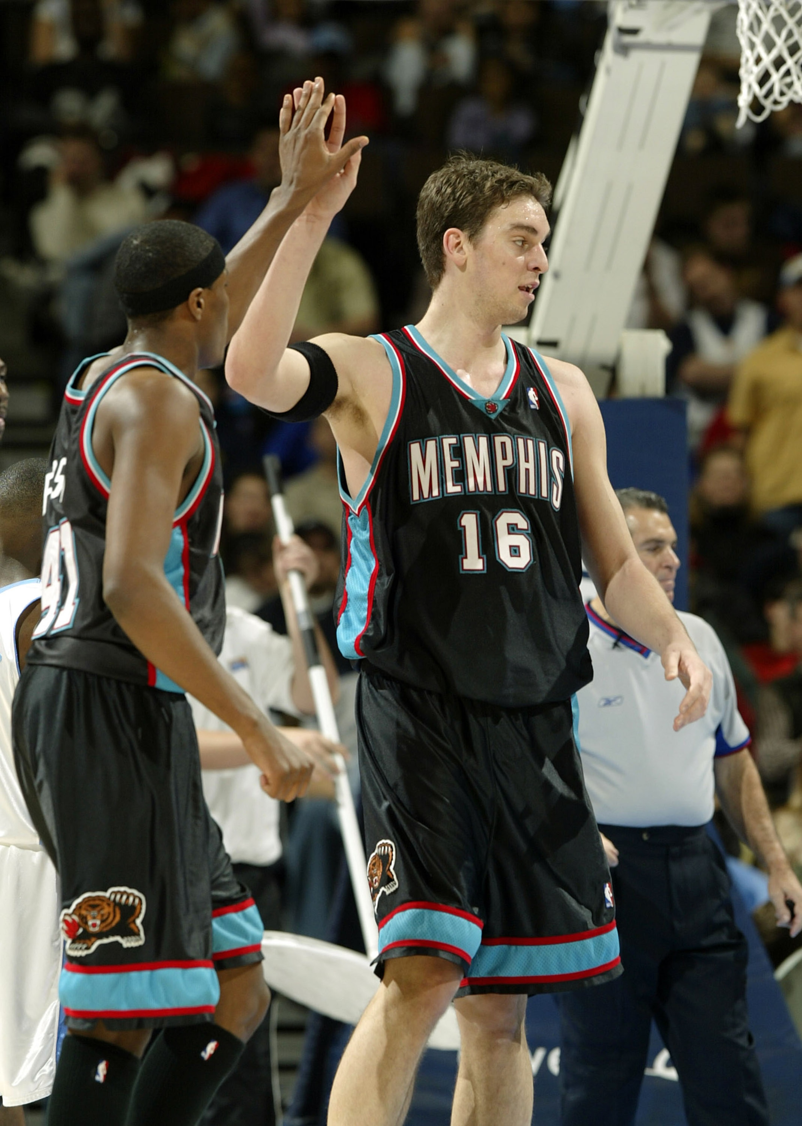 DENVER - DECEMBER 22:  Pau Gasol #16 of the Memphis Grizzlies high fives James Posey #41 after picking up a free throw against the Denver Nuggets in the first half December 22, 2003 at the Pepsi Center in Denver, Colorado.  NOTE TO USER:  User expressly a