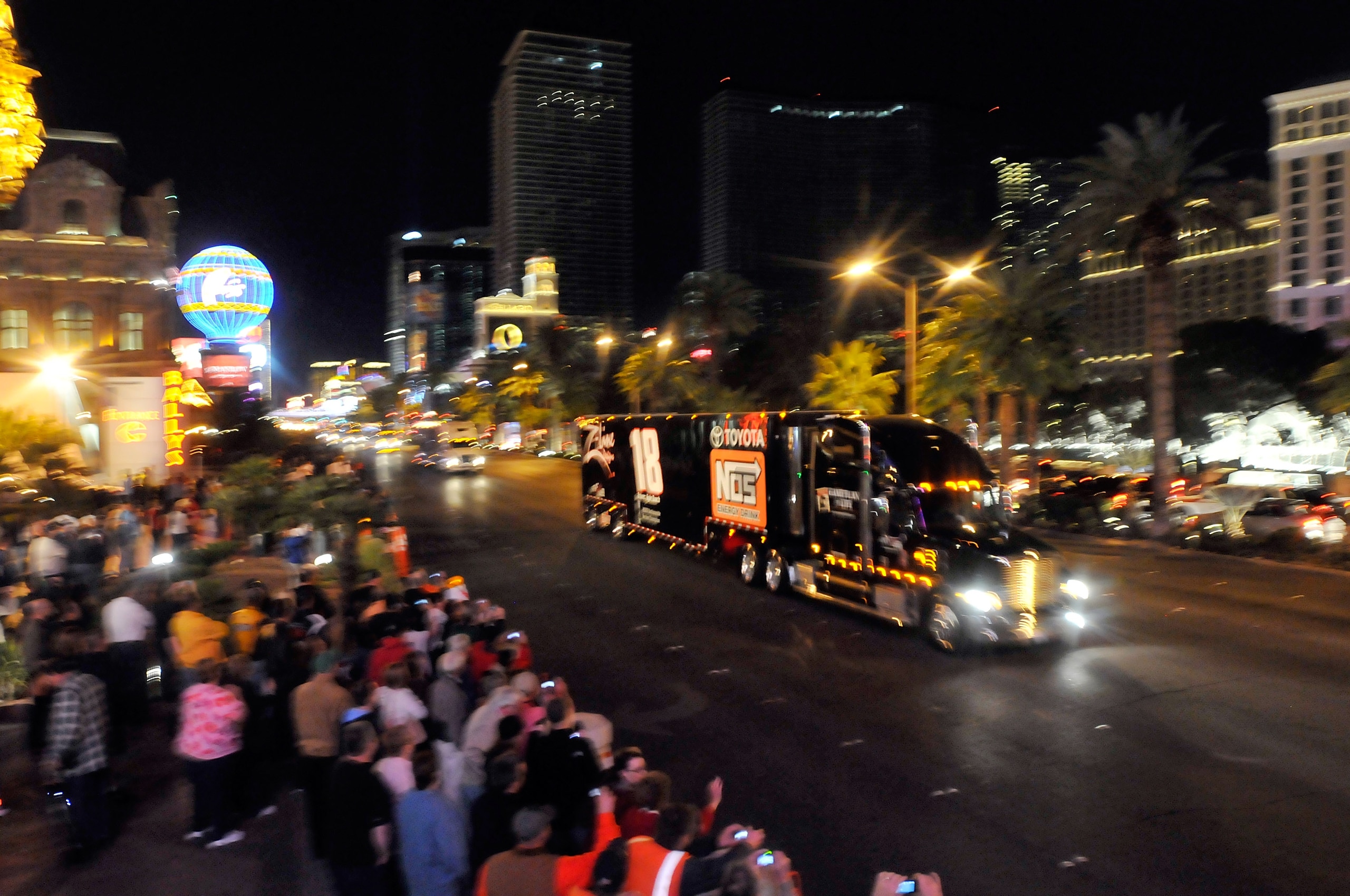 LAS VEGAS - FEBRUARY 25:  Racing fans cheers as NASCAR car haulers parade down the Las Vegas Strip Thursday, February 25, 2010 in Las Vegas, Nevada. Racers will compete in the 2010 Shelby American, the third race of the NASCAR Sprint Cup Series race at th