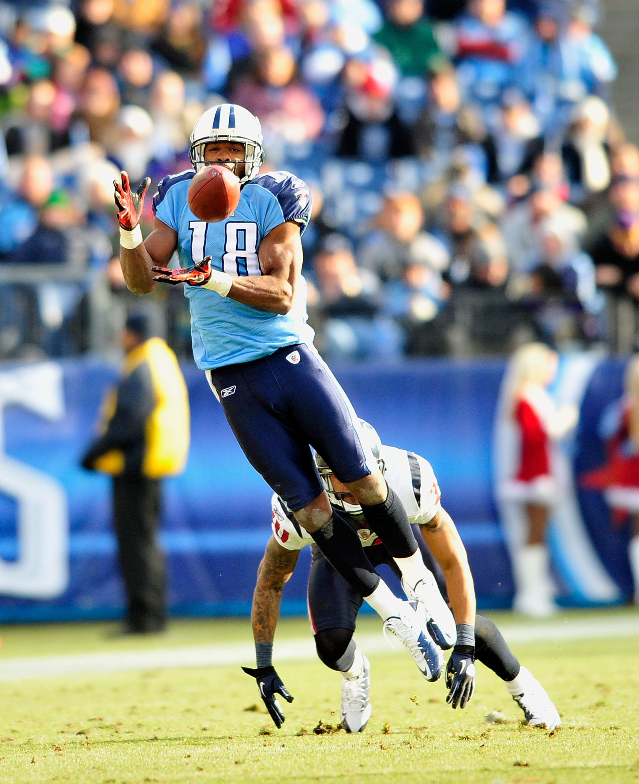 NASHVILLE, TN - DECEMBER 19:  Kenny Britt #18 of the Tennessee Titans makes a catch as Jason Allen #30 of the Houston Texans defends at LP Field on December 19, 2010 in Nashville, Tennessee. The Titans defeated the Texans, 31-17.  (Photo by Grant Halverso