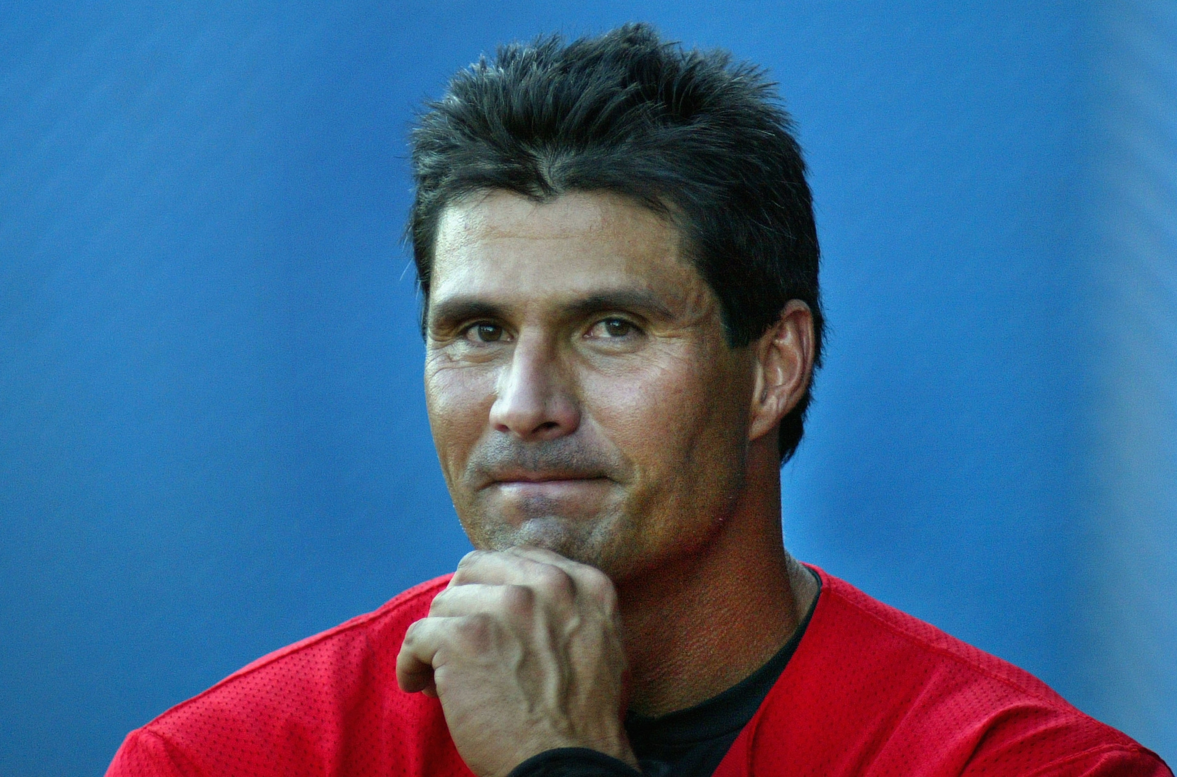 LONG BEACH, CA - JULY 14:  Jose Canseco #33 of the Long Beach Armada scratches his chin in the dugout during the Golden Baseball League game against the Fullerton Flyers on July 14,2006 at Blair Field in Long Beach, California.  (Photo By Christian Peters