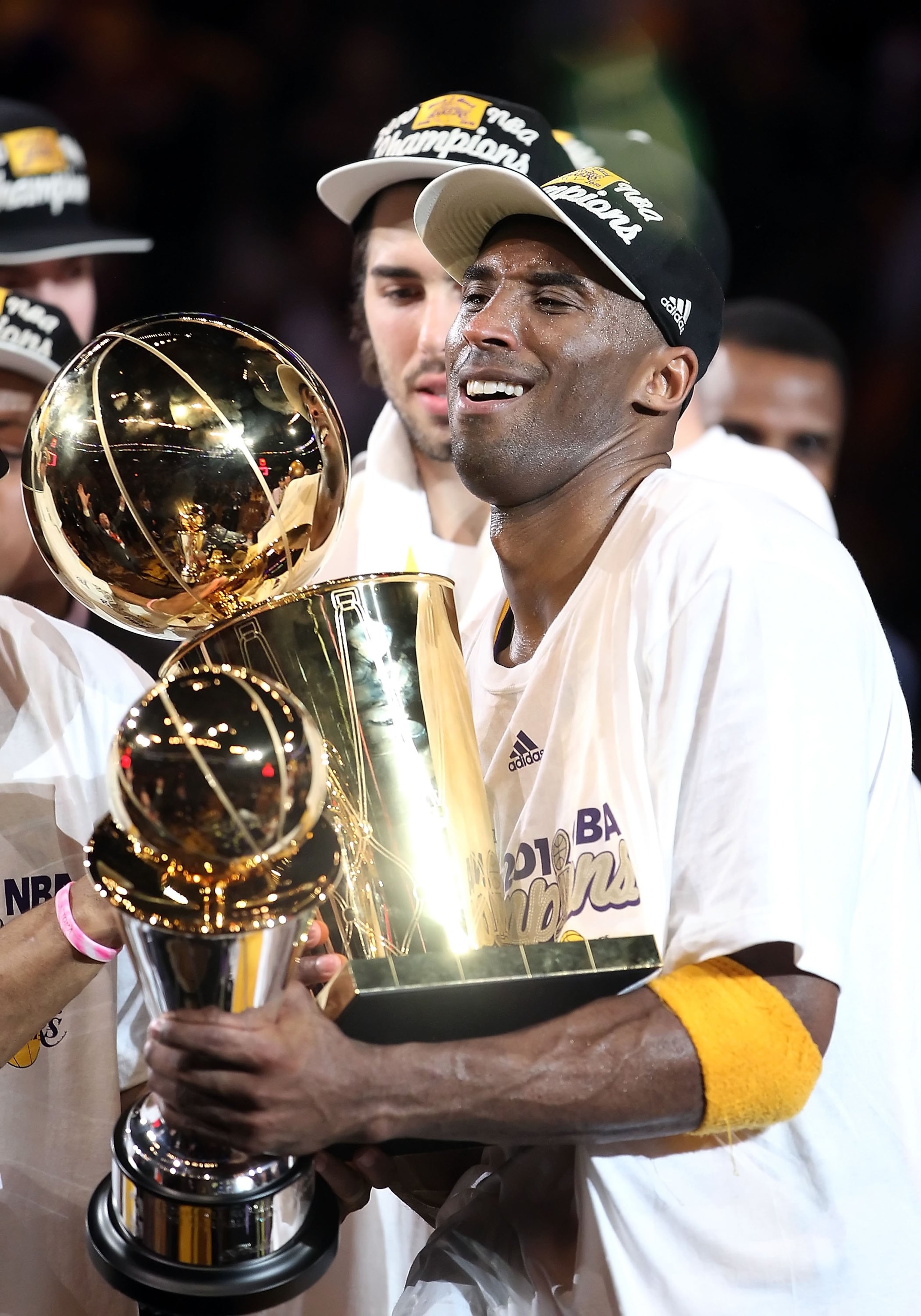LOS ANGELES, CA - JUNE 17:  Kobe Bryant #24 of the Los Angeles Lakers holds both the Larry O'Brien trophy and the Bill Russell Finals MVP trophy after the Lakers defeated the Boston Celtics 83-79 in Game Seven of the 2010 NBA Finals at Staples Center on J