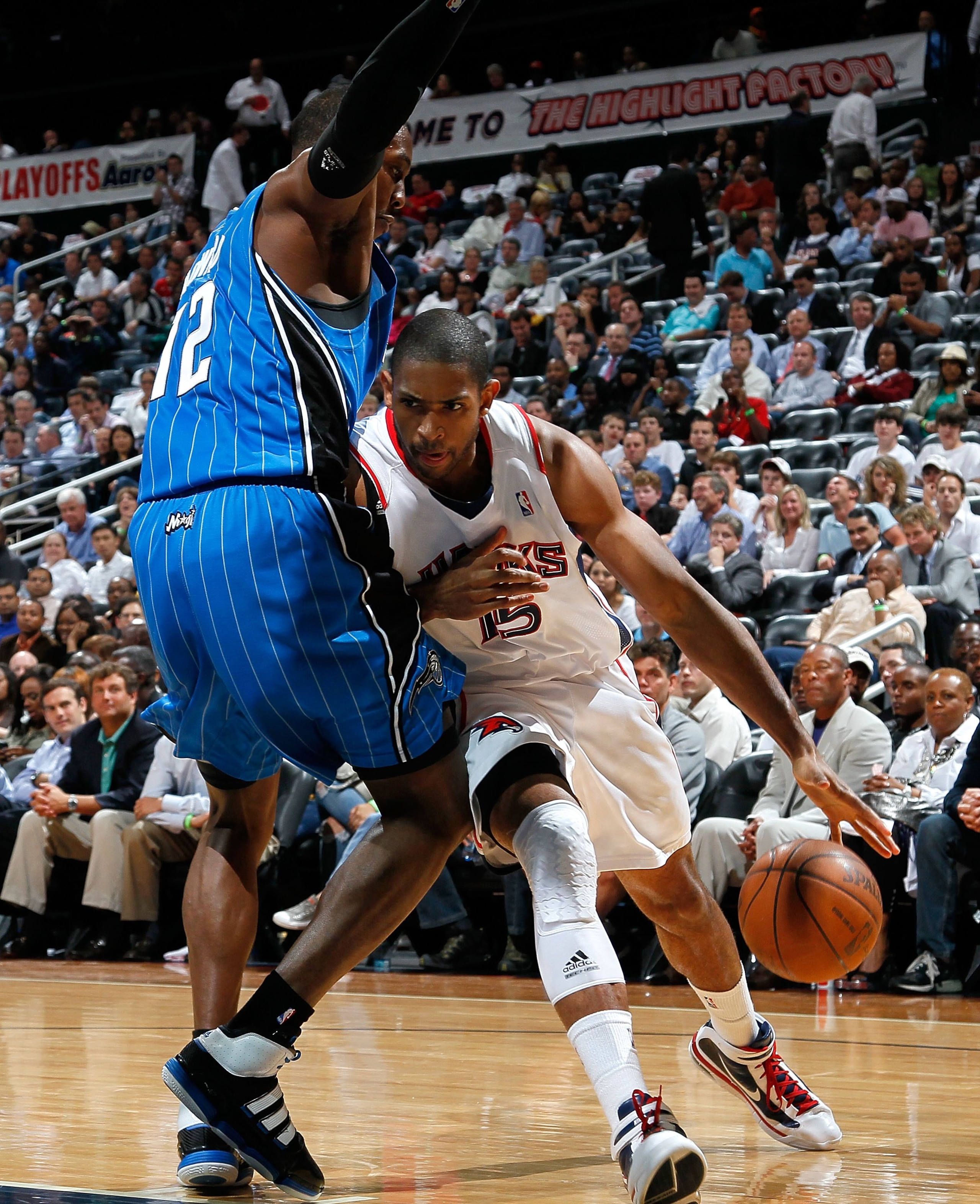 ATLANTA - MAY 10:  Al Horford #15 of the Atlanta Hawks against Dwight Howard #12 of the Orlando Magic during Game Four of the Eastern Conference Semifinals of the 2010 NBA Playoffs at Philips Arena on May 10, 2010 in Atlanta, Georgia.  NOTE TO USER: User