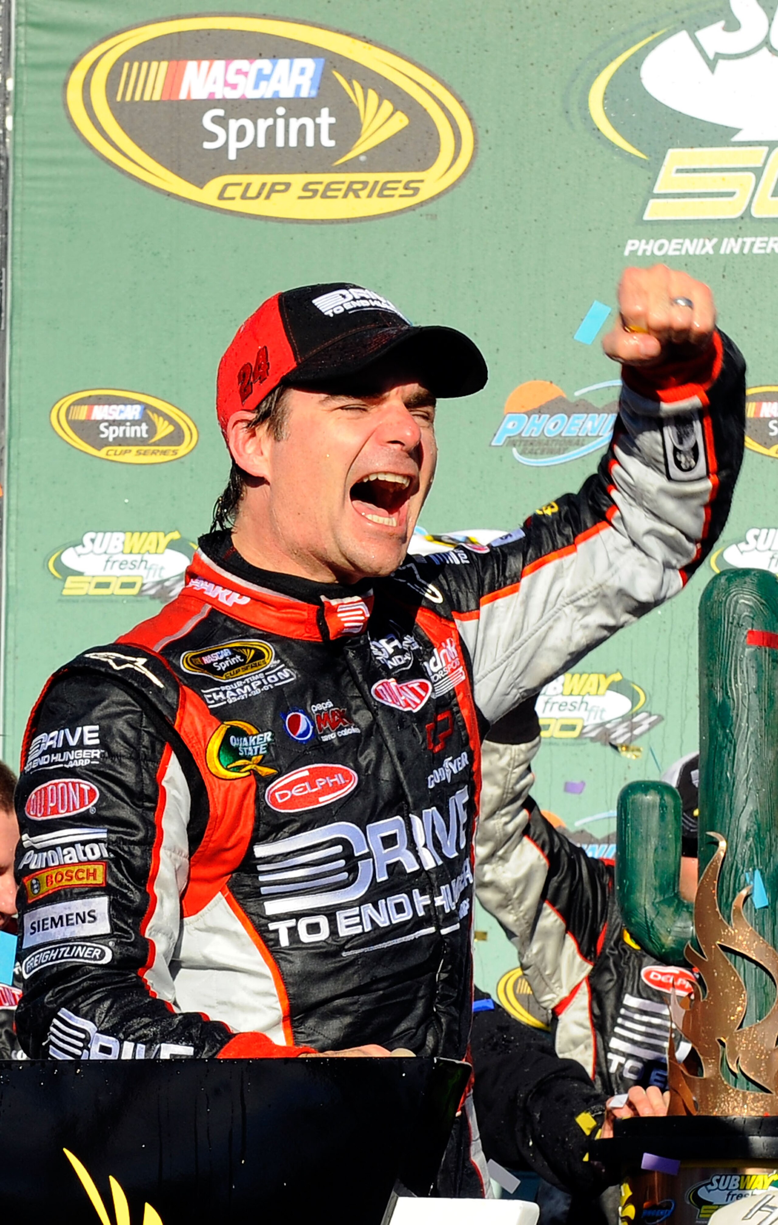 AVONDALE, AZ - FEBRUARY 27:  Jeff Gordon, driver of the #24 Drive to End Hunger Chevrolet, celebrates in victory lane after winning the NASCAR Sprint Cup Series Subway Fresh Fit 500 at Phoenix International Raceway on February 27, 2011 in Avondale, Arizon