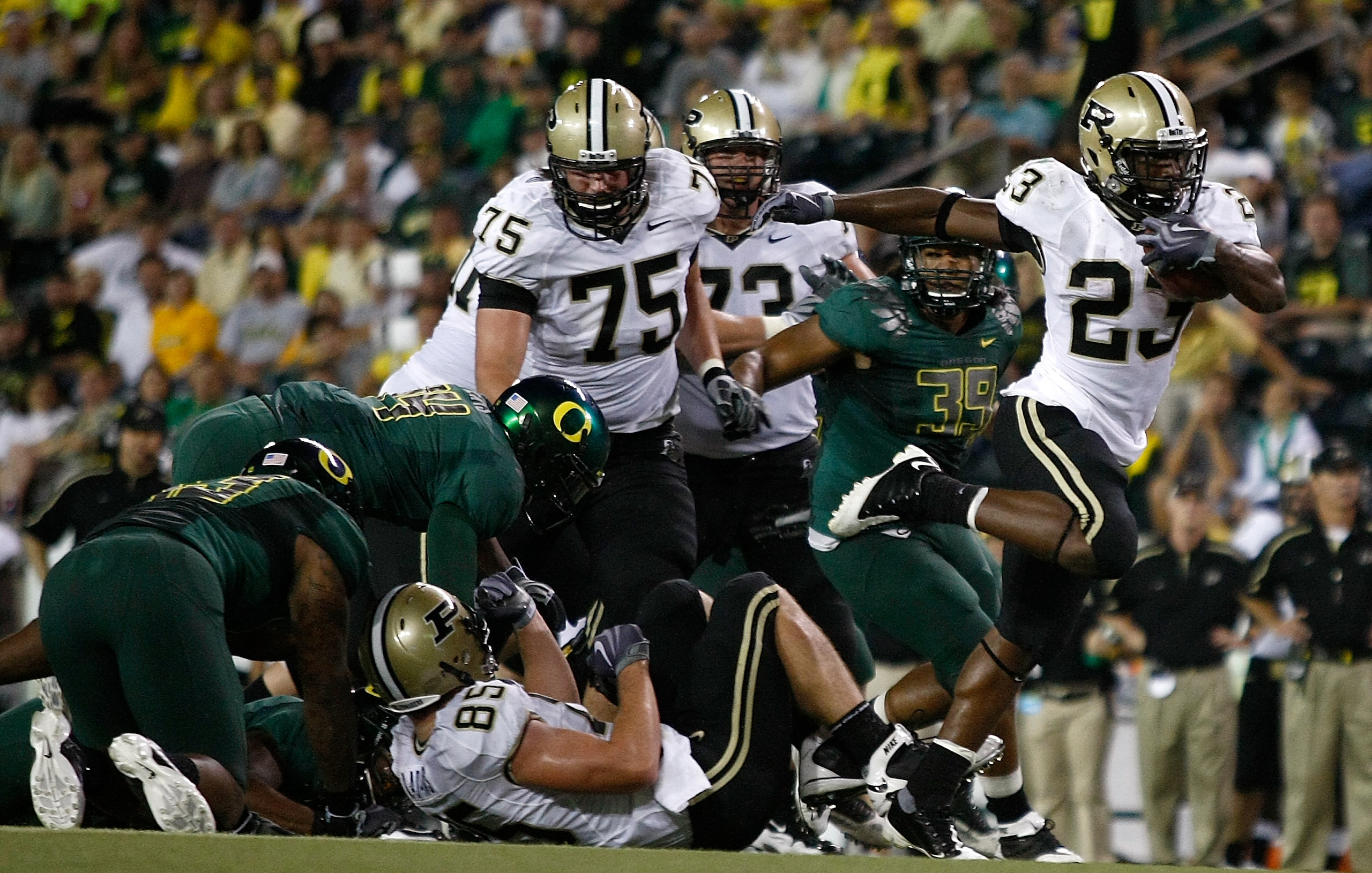 EUGENE, OR - SEPTEMBER 12: Ralph Bolden #23 of the Purdue Boilermakers runs the ball against the Oregon Ducks at Autzen Stadium on September 12, 2009 in Eugene, Oregon. (Photo by Jonathan Ferrey/Getty Images) EUGENE, OR - SEPTEMBER 12: Ralph Bolden #23 of the Purdue Boilermakers runs the ball against the Oregon Ducks at Autzen Stadium on September 12, 2009 in Eugene, Oregon. (Photo by Jonathan Ferrey/Getty Images)