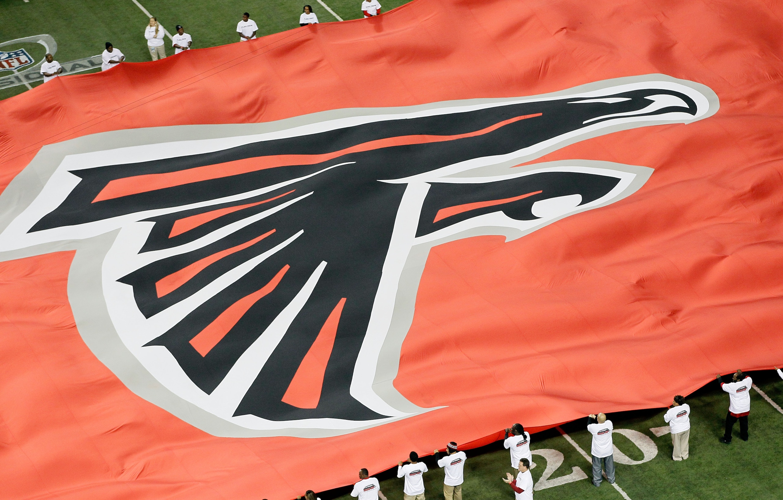 ATLANTA, GA - JANUARY 15:  A giant flag with the Atlanta Falcons logo is seen on the field against the Green Bay Packers during their 2011 NFC divisional playoff game at Georgia Dome on January 15, 2011 in Atlanta, Georgia.  (Photo by Kevin C. Cox/Getty I