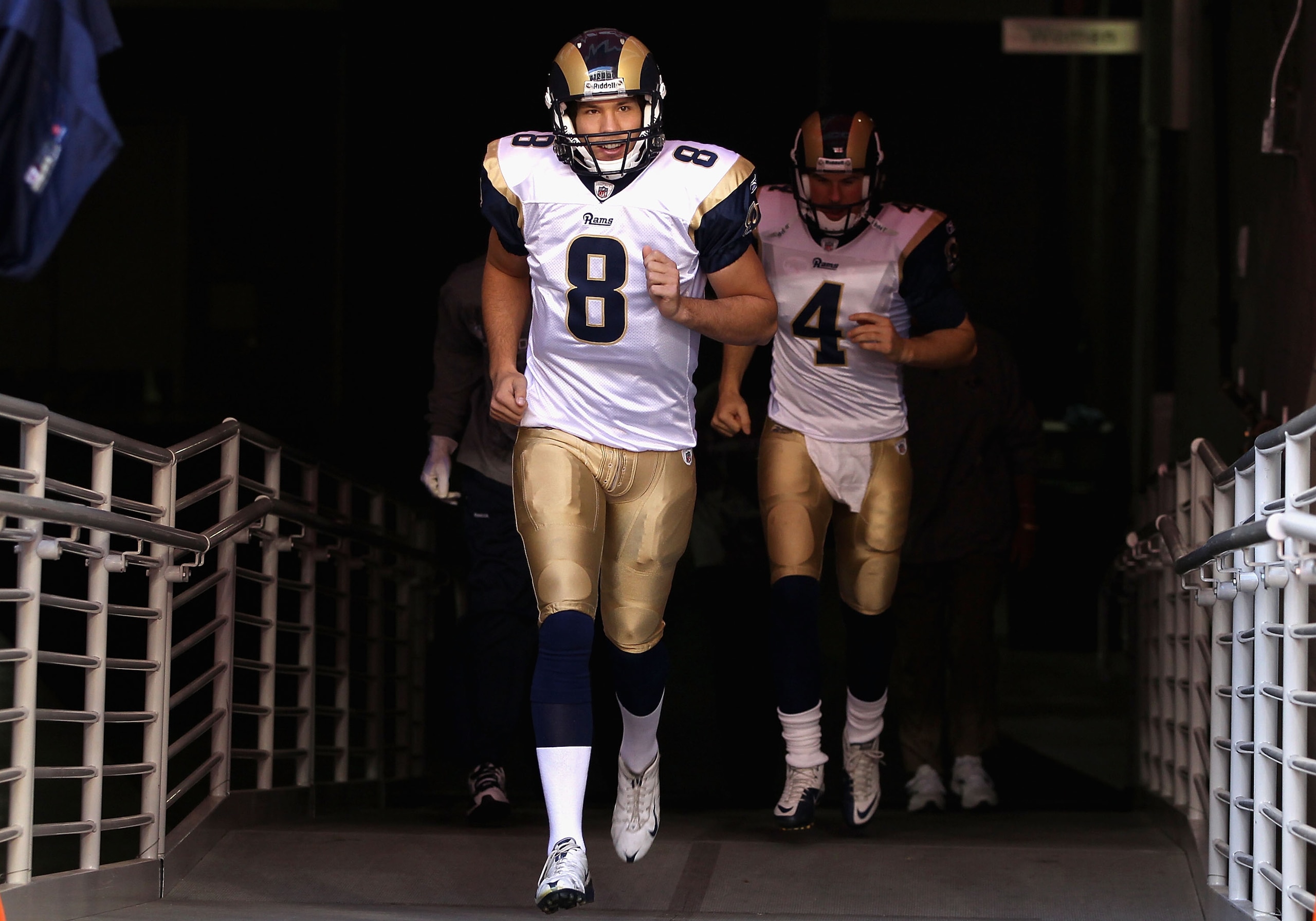 GLENDALE, AZ - DECEMBER 05:  Quarterback Sam Bradford #8 of the St. Louis Rams runs out onto the field before the NFL game against the Arizona Cardinals at the University of Phoenix Stadium on December 5, 2010 in Glendale, Arizona.  (Photo by Christian Pe