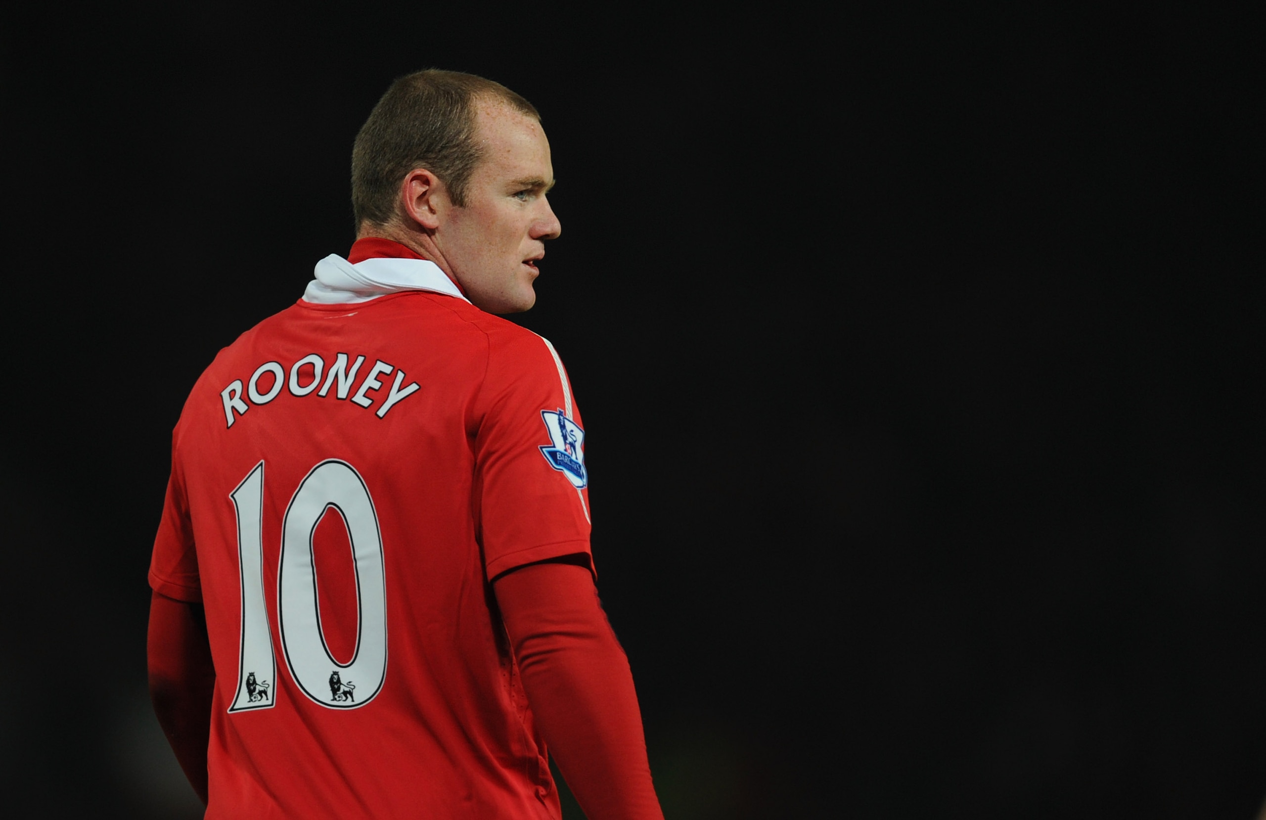 MANCHESTER, ENGLAND - NOVEMBER 20:  Wayne Rooney of Manchester United looks on during the Barclays Premier League match between Manchester United and Wigan Athletic at Old Trafford on November 20, 2010 in Manchester, England.  (Photo by Michael Regan/Gett