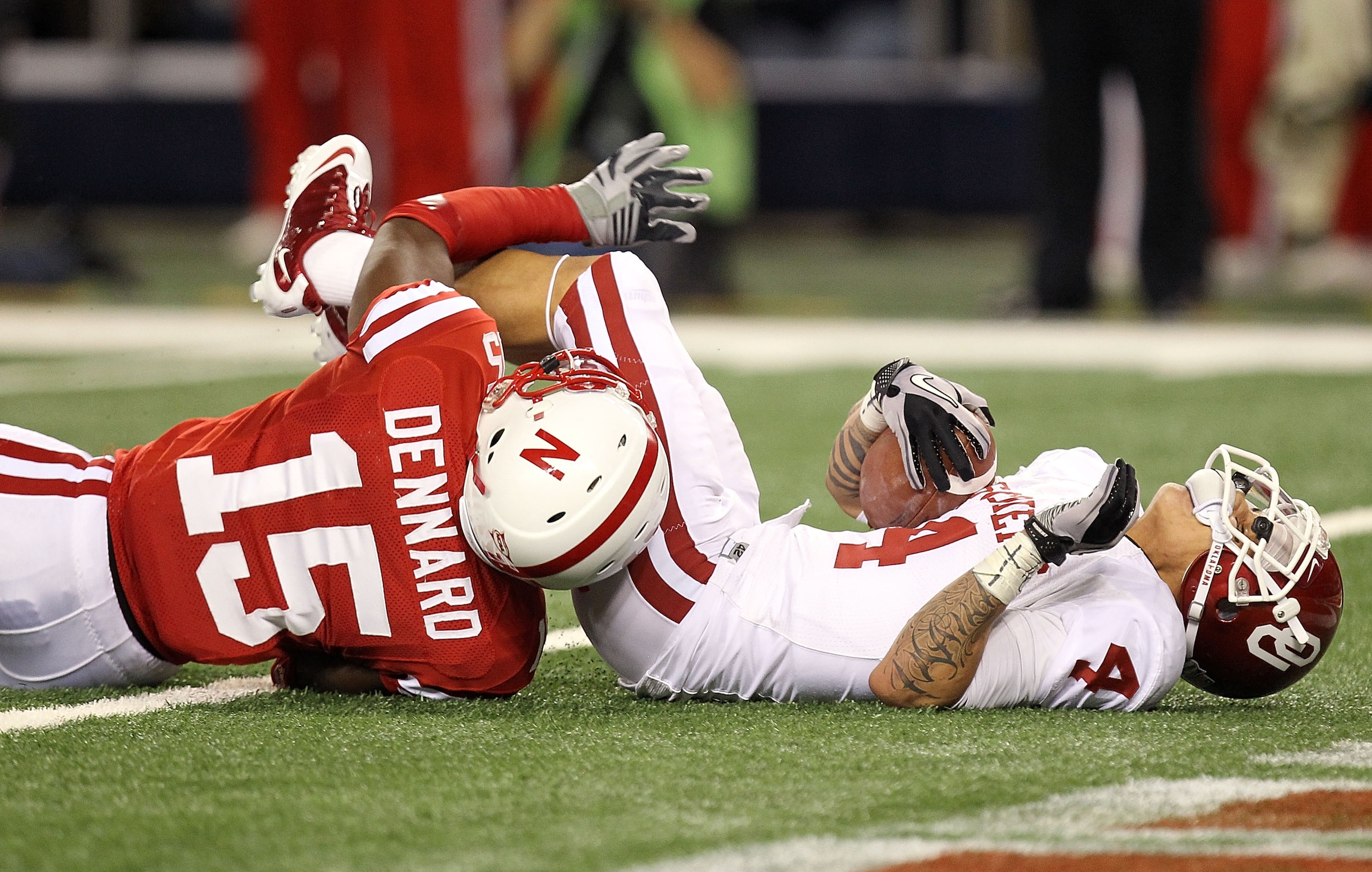 ARLINGTON, TX - DECEMBER 04: Wide receiver Kenny Stills #4 of the Oklahoma Sooners runs the ball to the one yard line against Alfonzo Dennard #15 of the Nebraska Cornhuskers during the Big 12 Championship at Cowboys Stadium on December 4, 2010 in Arlingt ARLINGTON, TX - DECEMBER 04: Wide receiver Kenny Stills #4 of the Oklahoma Sooners runs the ball to the one yard line against Alfonzo Dennard #15 of the Nebraska Cornhuskers during the Big 12 Championship at Cowboys Stadium on December 4, 2010 in Arlingt
