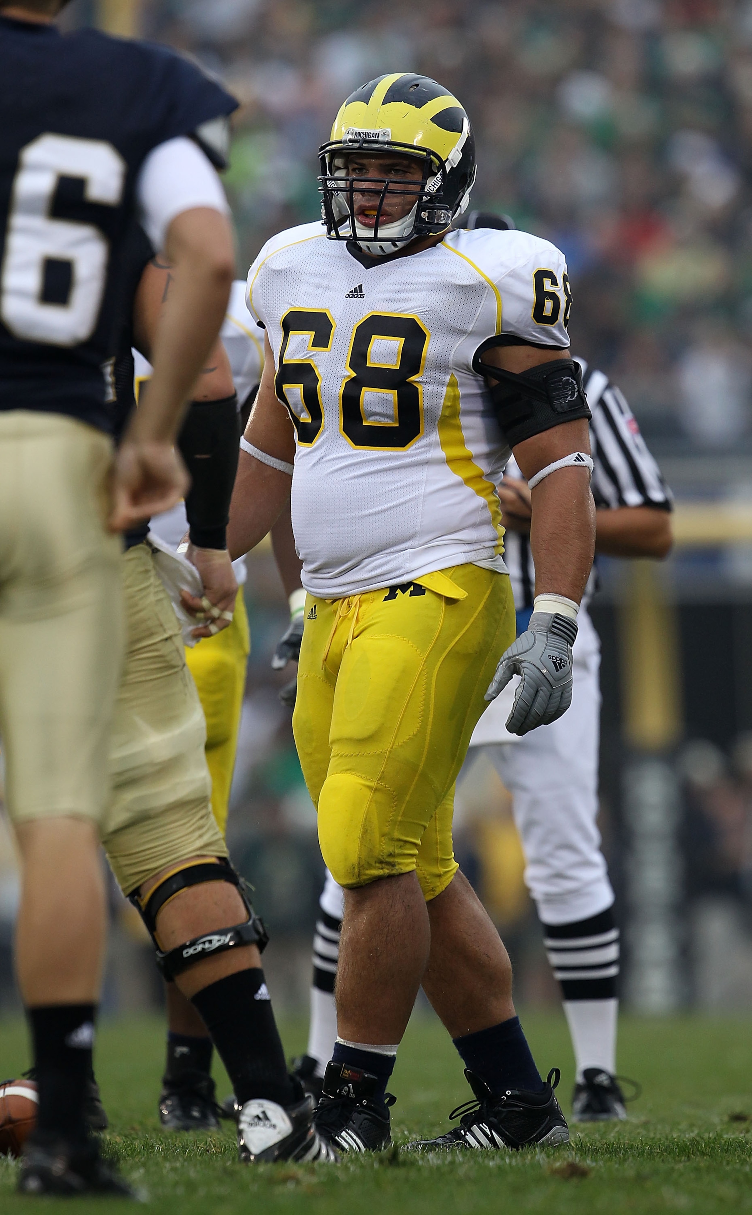 SOUTH BEND, IN - SEPTEMBER 11: Mike Martin #68 of the Michigan Wolverines awaits the start of play against the Notre Dame Fighting Irish at Notre Dame Stadium on September 11, 2010 in South Bend, Indiana. Michigan defeated Notre Dame 28-24. (Photo by Jon SOUTH BEND, IN - SEPTEMBER 11: Mike Martin #68 of the Michigan Wolverines awaits the start of play against the Notre Dame Fighting Irish at Notre Dame Stadium on September 11, 2010 in South Bend, Indiana. Michigan defeated Notre Dame 28-24. (Photo by Jon