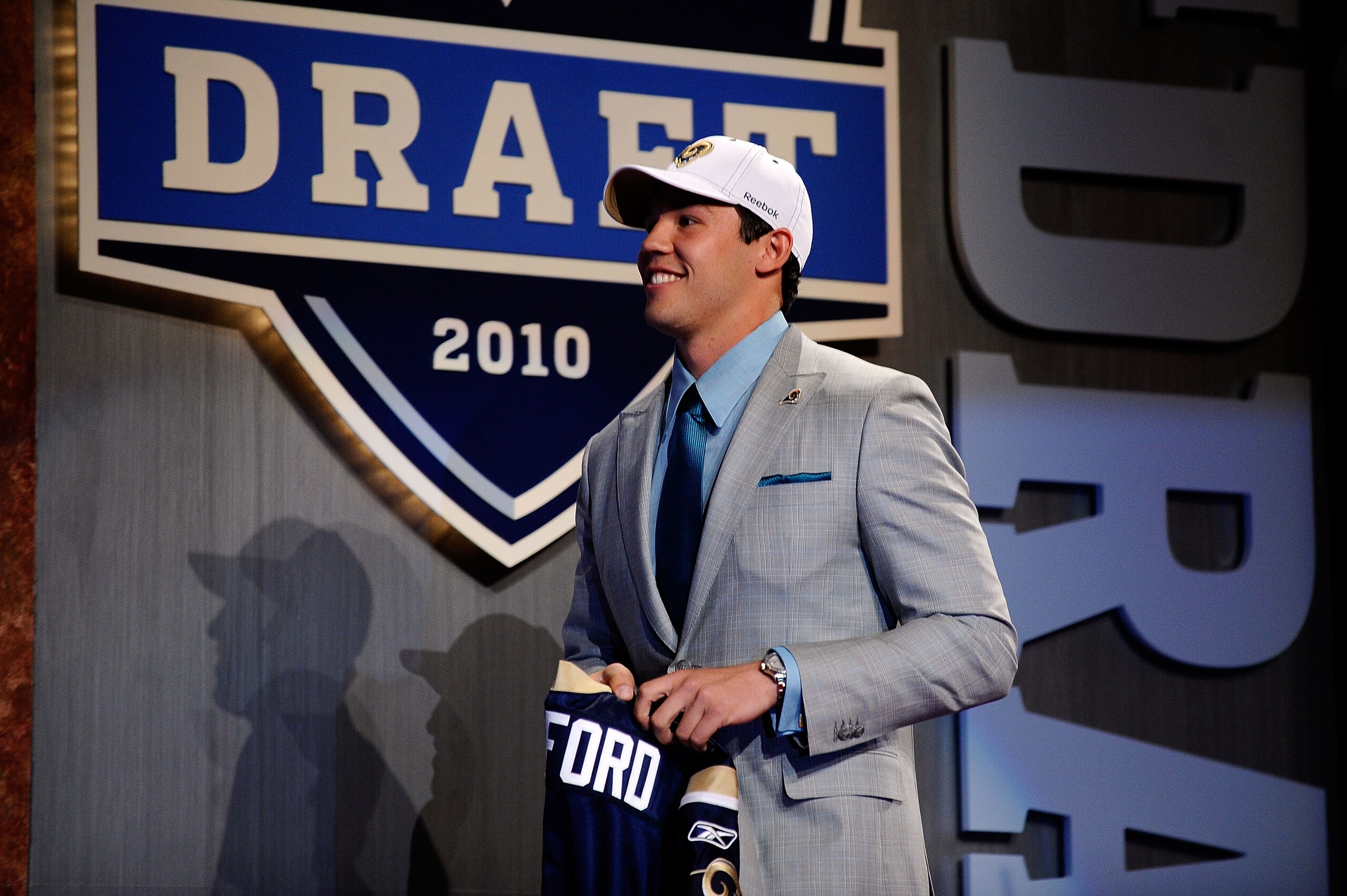 NEW YORK - APRIL 22:  Quarterback Sam Bradford from the Oklahoma Sooners walks up on stage after he was selected number 1 overall during the first round of the 2010 NFL Draft at Radio City Music Hall on April 22, 2010 in New York City.  (Photo by Jeff Zel