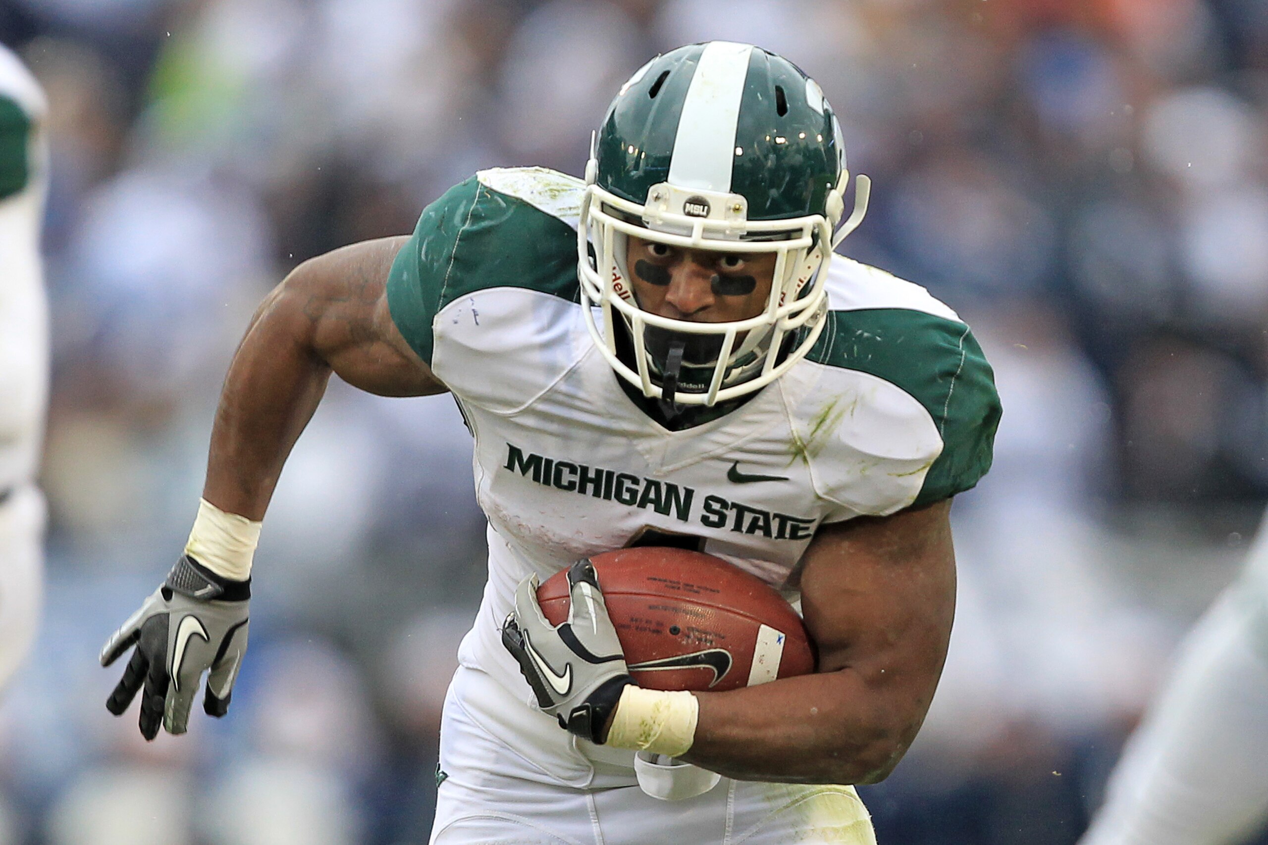 STATE COLLEGE, PA - NOVEMBER 27: Running back Edwin Baker #4 of the Michigan State Spartans carries the ball during a game against the Penn State Nittany Lions on November 27, 2010 at Beaver Stadium in State College, Pennsylvania. The Spartans won 28-22.( STATE COLLEGE, PA - NOVEMBER 27: Running back Edwin Baker #4 of the Michigan State Spartans carries the ball during a game against the Penn State Nittany Lions on November 27, 2010 at Beaver Stadium in State College, Pennsylvania. The Spartans won 28-22.(