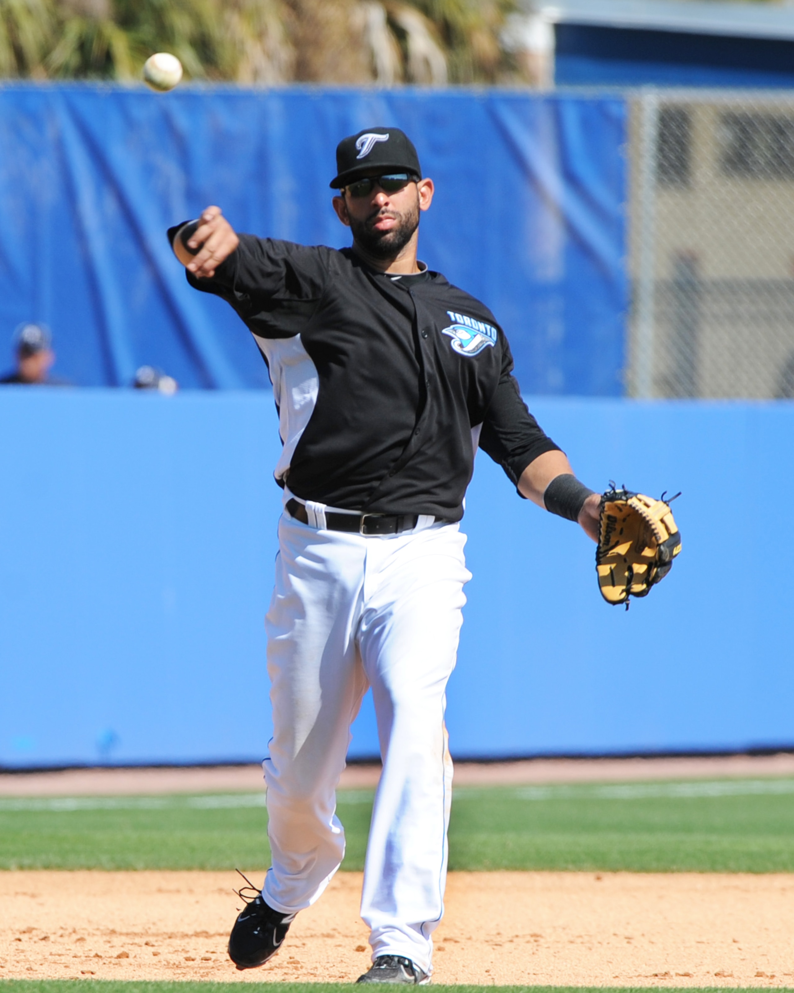 DUNEDIN, FL - FEBRUARY 26:  Infielder Jose Bautista #19 of the Toronto Blue Jays throws from third base against the Detroit Tigers February 26, 2011 at Florida Auto Exchange Stadium in Dunedin, Florida.  (Photo by Al Messerschmidt/Getty Images)