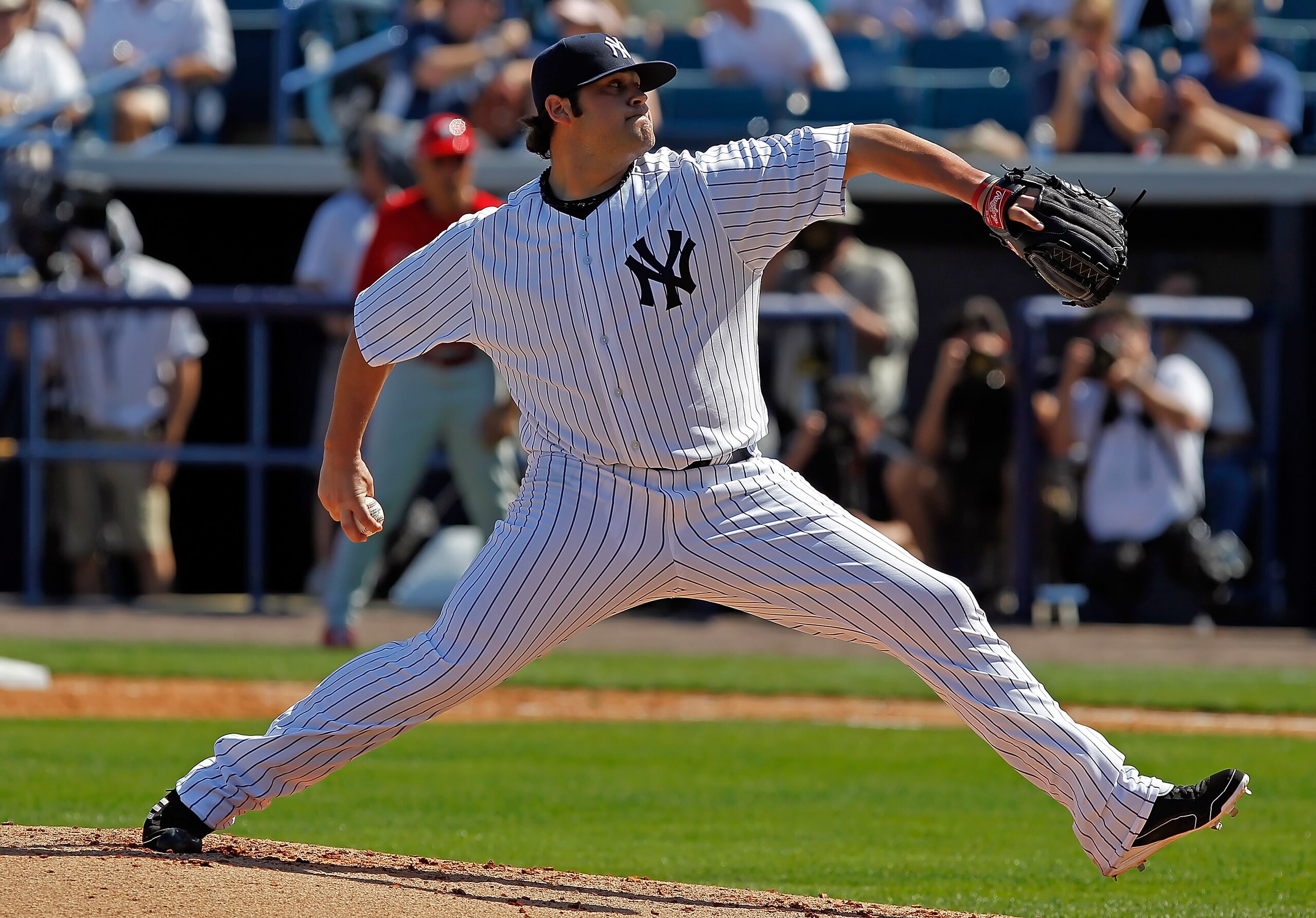 TAMPA, FL - FEBRUARY 26:  Pitcher Joba Chamberlain #62 of the New York Yankees pitches against the Philadelphia Phillies during a Grapefruit League Spring Training Game at George M. Steinbrenner Field on February 26, 2011 in Tampa, Florida.  (Photo by J.