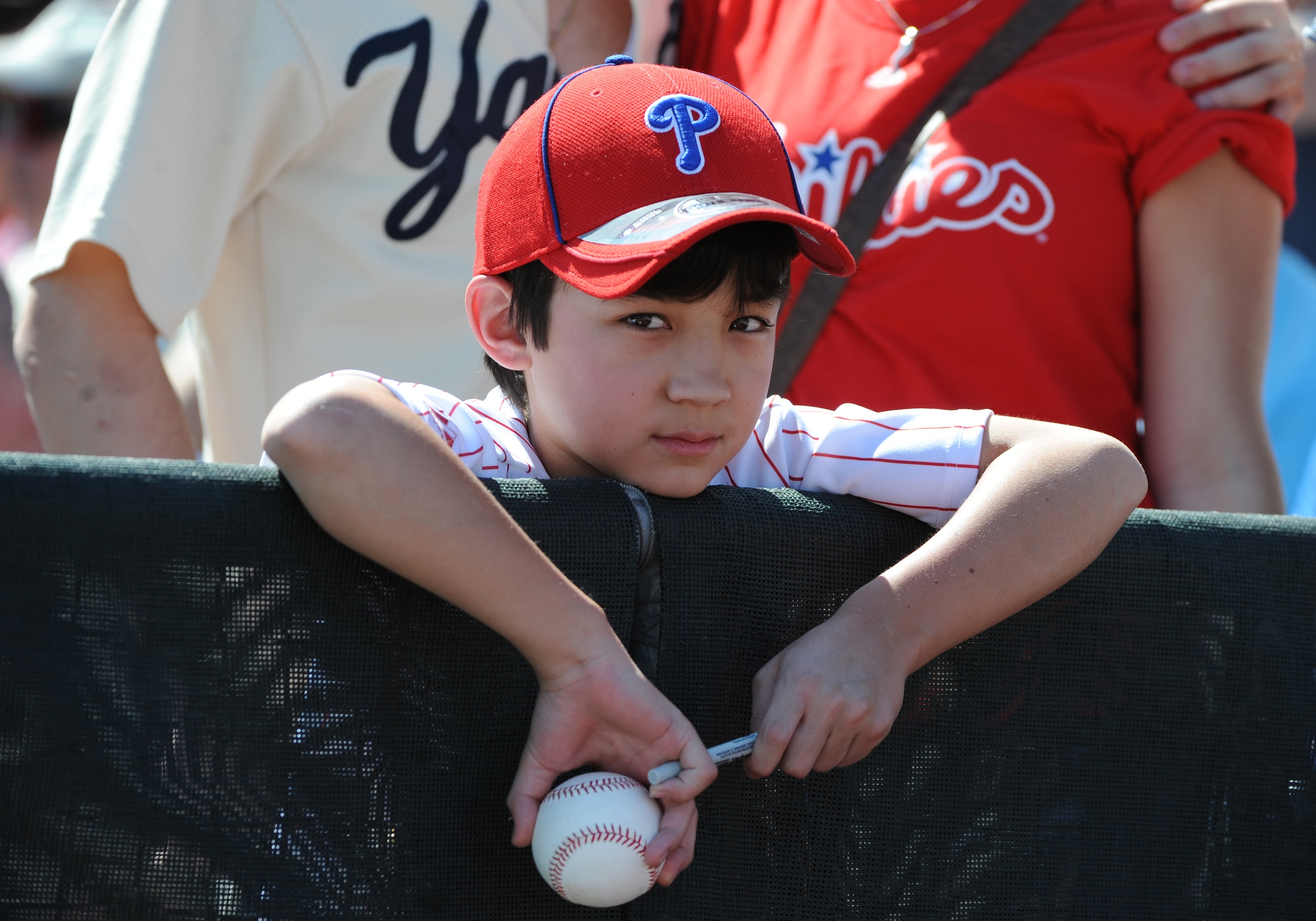 CLEARWATER, FL - FEBRUARY 27:  A young fan of the Philadelphia Phillies waits for an autograph before play against the New York Yankees February 27, 2011 at Bright House Field in Clearwater, Florida.  (Photo by Al Messerschmidt/Getty Images)