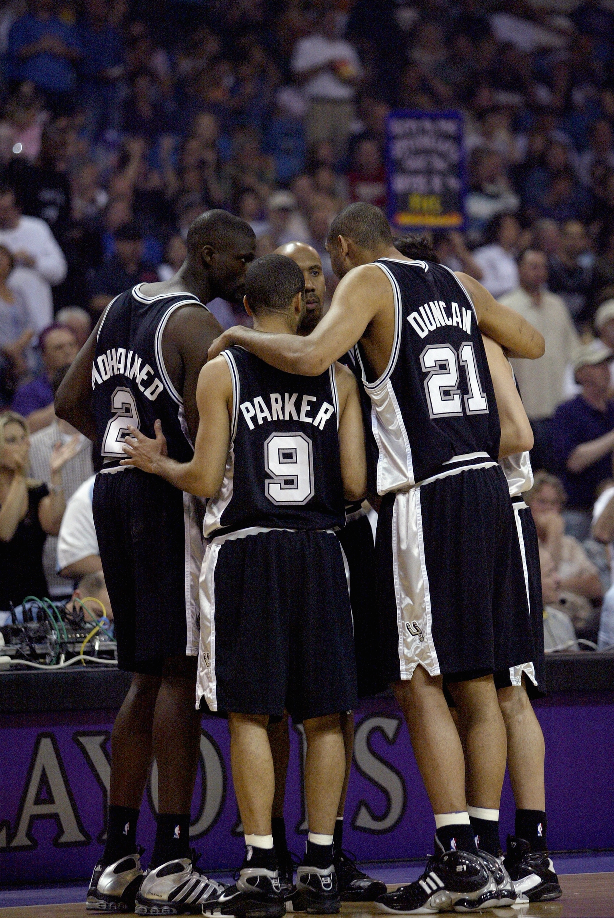 SACRAMENTO, CA - APRIL 28: Tony Parker #9, Tim Duncan #21 and the San Antonio Spurs huddle in game three of the Western Conference Quarterfinals against the Sacramento Kings during the 2006 NBA Playoffs on April 28, 2006 at ARCO Arena in Sacramento, Calif SACRAMENTO, CA - APRIL 28: Tony Parker #9, Tim Duncan #21 and the San Antonio Spurs huddle in game three of the Western Conference Quarterfinals against the Sacramento Kings during the 2006 NBA Playoffs on April 28, 2006 at ARCO Arena in Sacramento, Calif