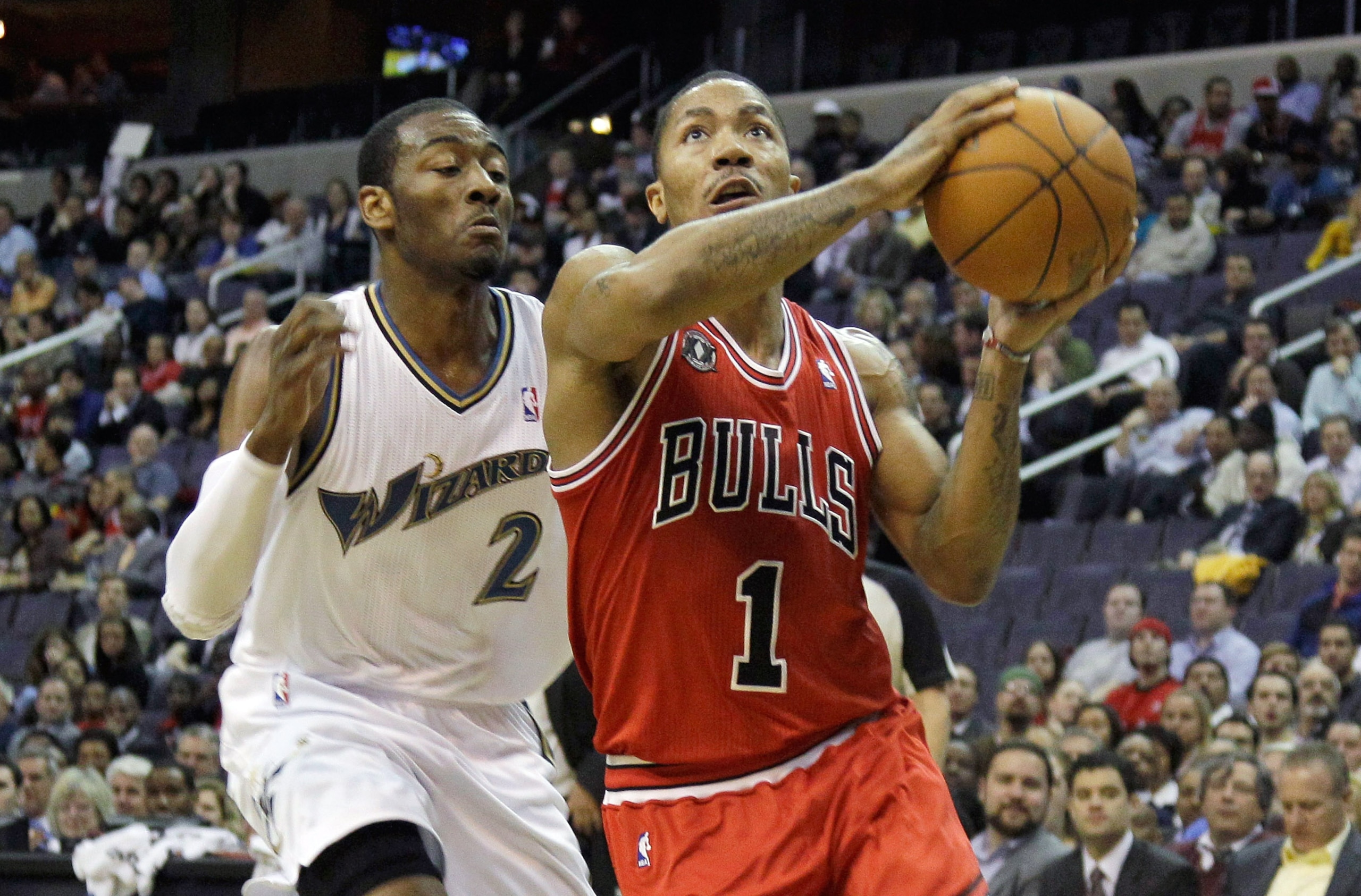 WASHINGTON, DC - FEBRUARY 28: Derrick Rose #1 of the Chicago Bulls drives to the basket while being guarded by John Wall #2 of the Washington Wizardsat the Verizon Center in Washington on February 28, 2011 in Washington, DC. NOTE TO USER: User expressly a WASHINGTON, DC - FEBRUARY 28: Derrick Rose #1 of the Chicago Bulls drives to the basket while being guarded by John Wall #2 of the Washington Wizardsat the Verizon Center in Washington on February 28, 2011 in Washington, DC. NOTE TO USER: User expressly a