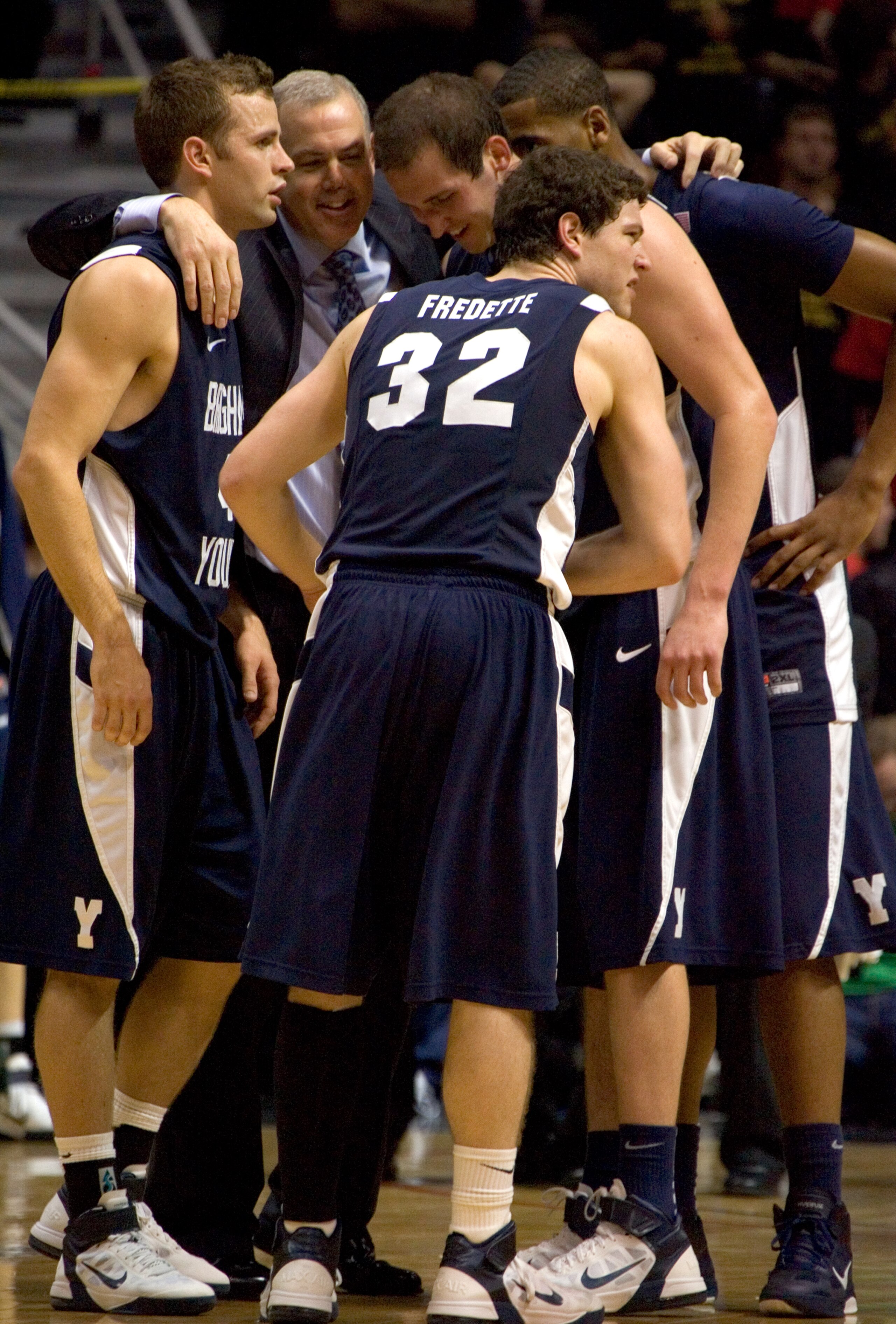 SAN DIEGO, CA - FEBRUARY 26:  Jimmer Fredette #32 of the Brigham Young Cougars celebrates with teammates and coach Dave Rose against the San Diego State Aztecs during the second half at Cox Arena on February 26, 2011 in San Diego, California. BYU beat SDS