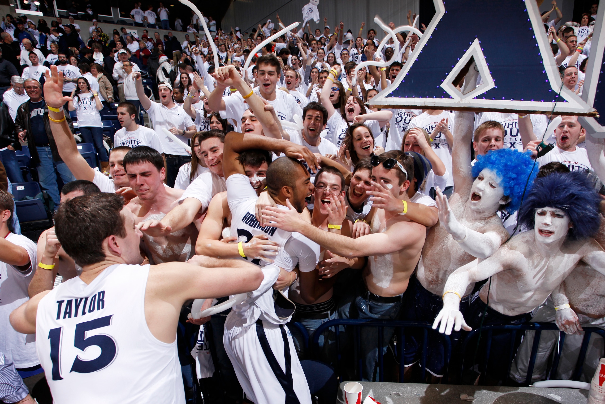 CINCINNATI, OH - DECEMBER 9: Xavier Musketeers players celebrate with fans after the game against the Butler Bulldogs at Cintas Center on December 9, 2010 in Cincinnati, Ohio. Xavier defeated Butler 51-49. (Photo by Joe Robbins/Getty Images)