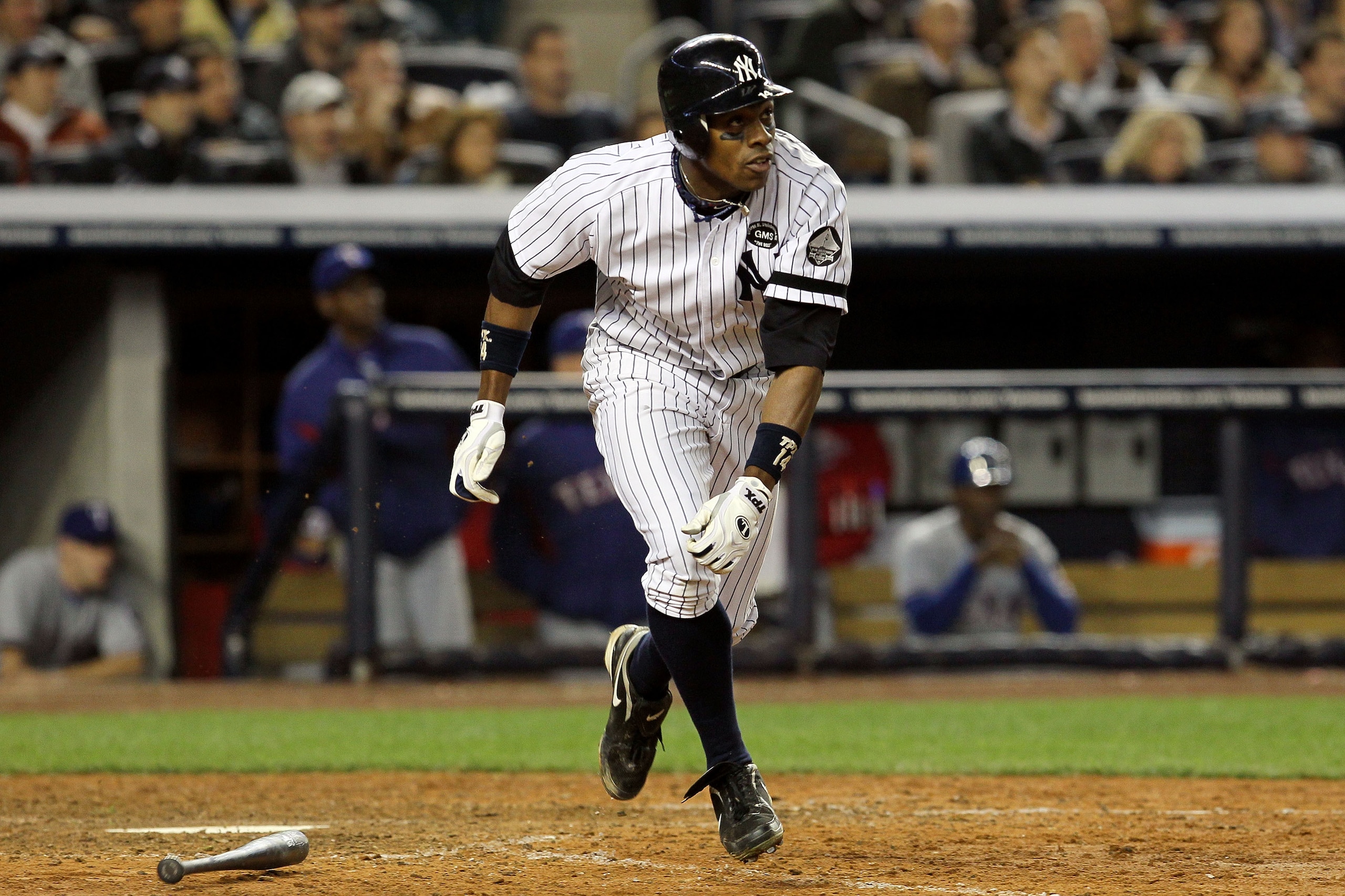 NEW YORK - OCTOBER 20:  Curtis Granderson #14 of the New York Yankees hits a solo home run in the bottom of the eighth inning against Alexi Ogando #64 of the Texas Rangers in Game Five of the ALCS during the 2010 MLB Playoffs at Yankee Stadium on October