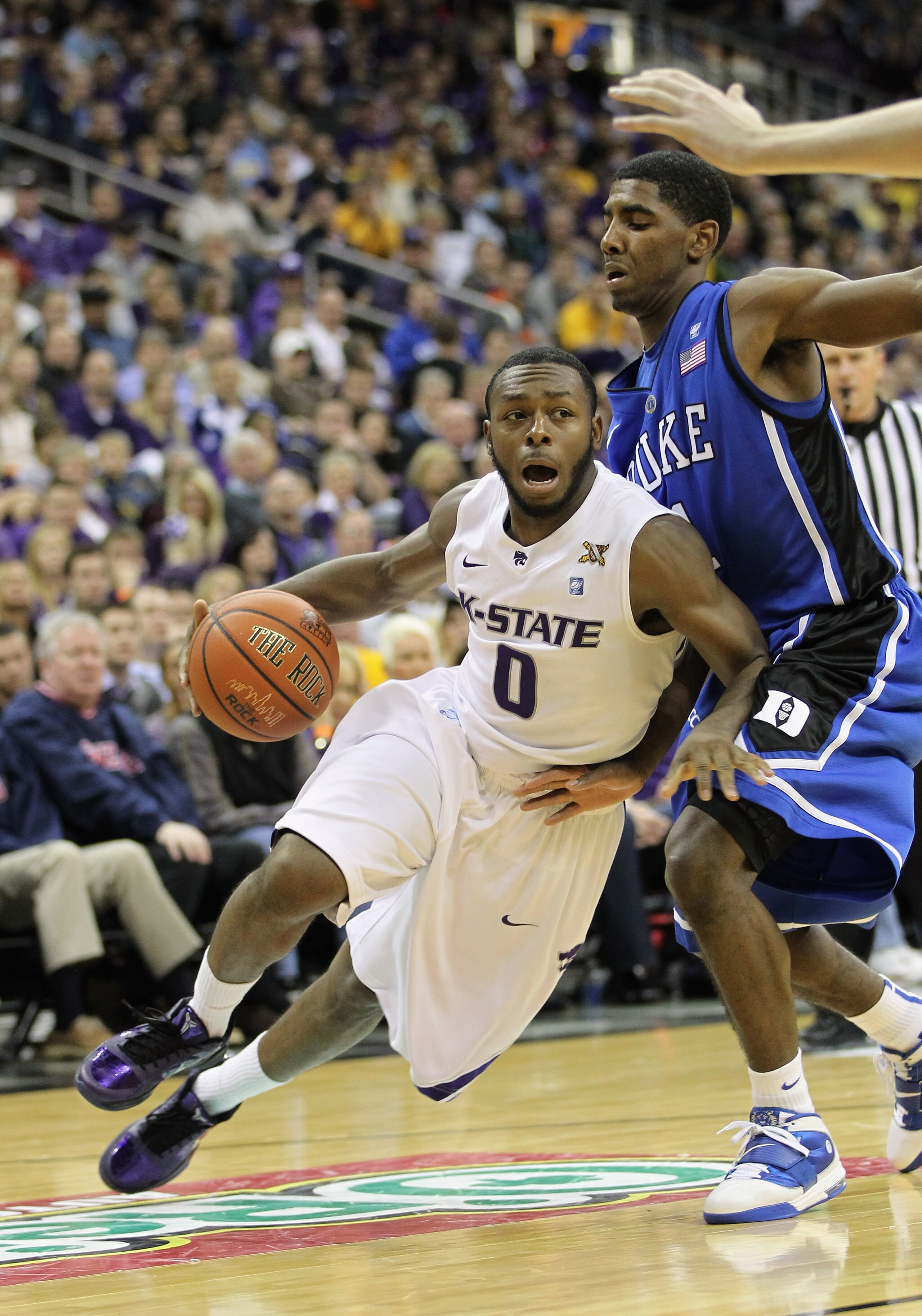KANSAS CITY, MO - NOVEMBER 23:  Jacob Pullen #0 of the Kansas State Wildcats drives as Kyrie Irving #1 of the Duke Blue Devils defends during the CBE Classic championship game on November 23, 2010 at the Sprint Center in Kansas City, Missouri.  (Photo by