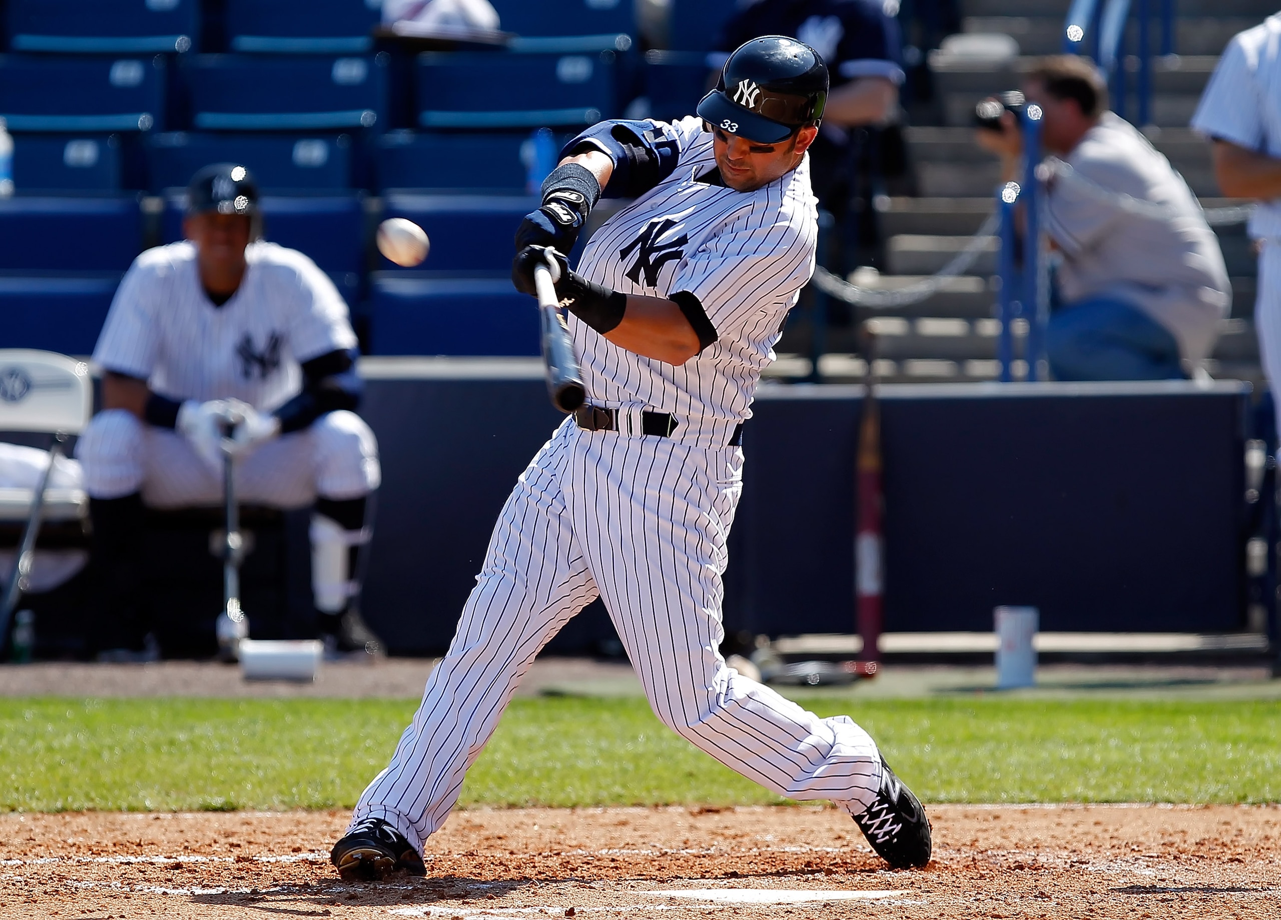 TAMPA, FL - FEBRUARY 26:  Outfielder Nick Swisher #33 of the New York Yankees fouls off a pitch against the Philadelphia Phillies during a Grapefruit League Spring Training Game at George M. Steinbrenner Field on February 26, 2011 in Tampa, Florida.  (Pho