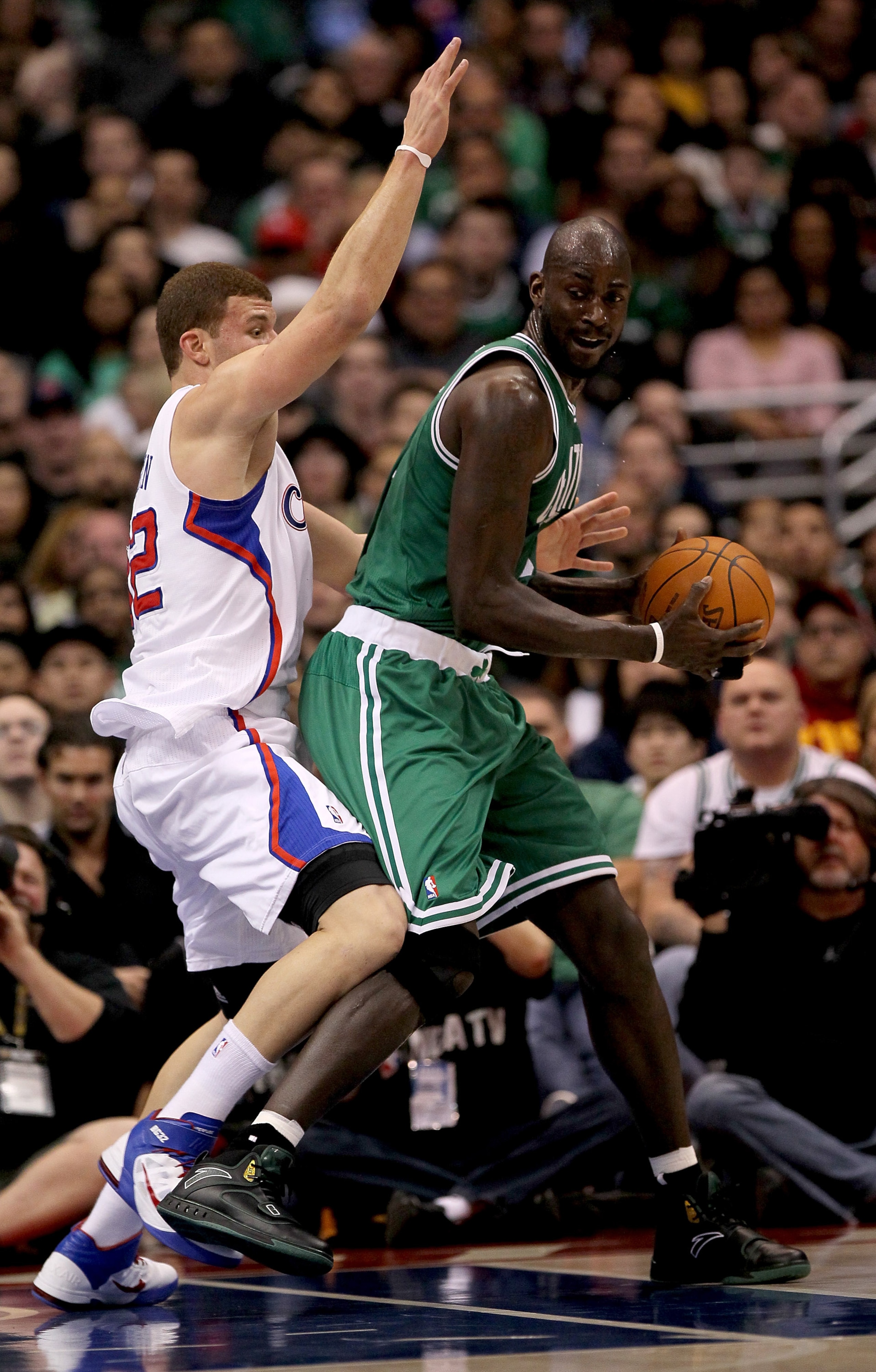 LOS ANGELES, CA - FEBRUARY 26:  Kevin Garnett #5 of the Boston Celtics controls the ball against Blake Griffin #32 of the Los Angeles Clippers at Staples Center on February 26, 2011  in Los Angeles, California.  NOTE TO USER: User expressly acknowledges a