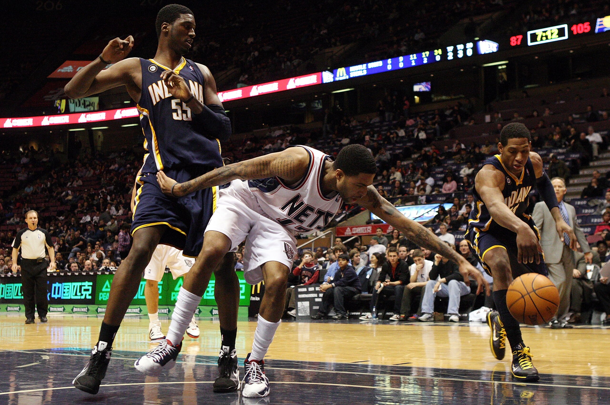EAST RUTHERFORD, NJ - JANUARY 15:  Chris Douglas-Roberts #17 of the New Jersey Nets loses the ball against Danny Granger #33 and Roy Hibbert #55 of the Indiana Pacers at the Izod Center on January 15, 2010 in East Rutherford, New Jersey. NOTE TO USER: Use