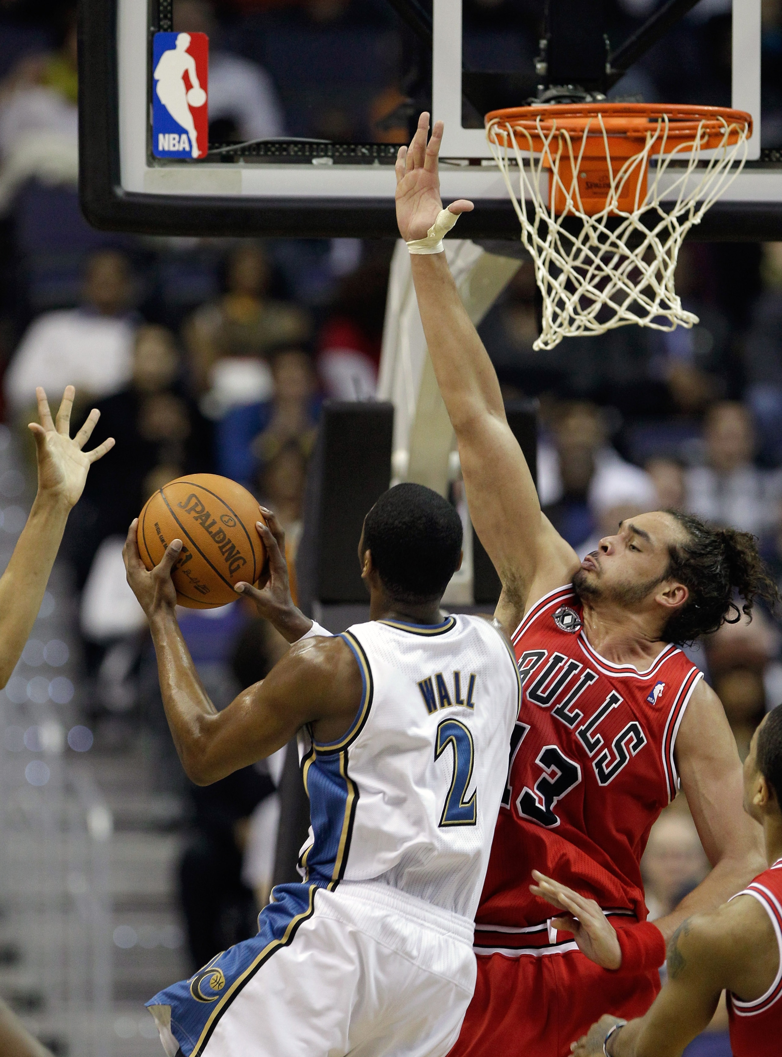 WASHINGTON, DC - FEBRUARY 28: John Wall #2 of the Washington Wizards puts up a shot while being guarded by Joakim Noah #13 of the Chicago Bulls at the Verizon Center in Washington on February 28, 2011 in Washington, DC. NOTE TO USER: User expressly acknow