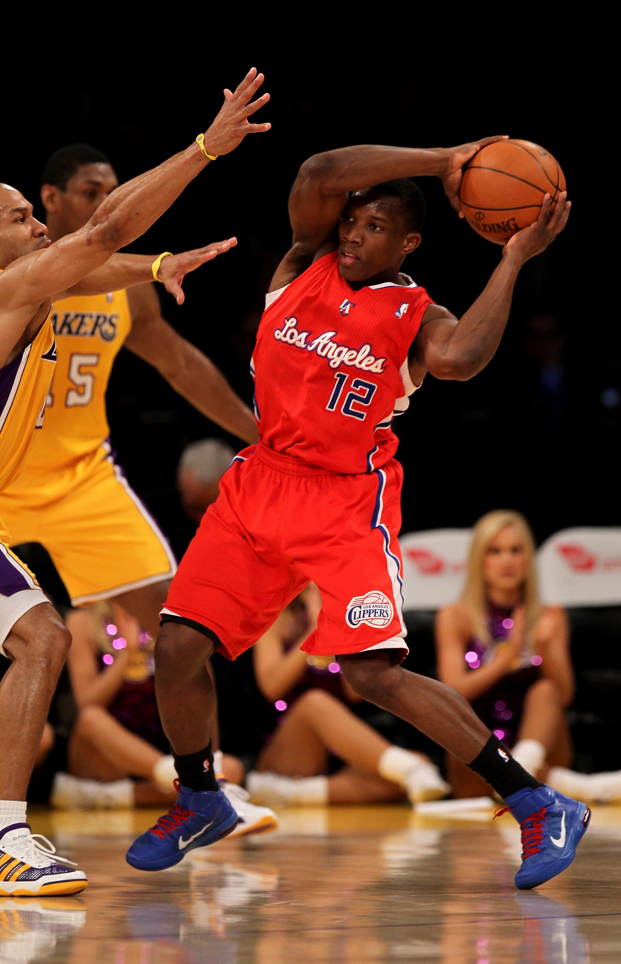 LOS ANGELES, CA - FEBRUARY 25:  Eric Bledsoe #12 of the Los Angeles Clippers controls the ball against Derek Fisher #2 of the Los Angeles Lakers at Staples Center on February 25, 2011 in Los Angeles, California. The Lakers won 100-88.  NOTE TO USER: User