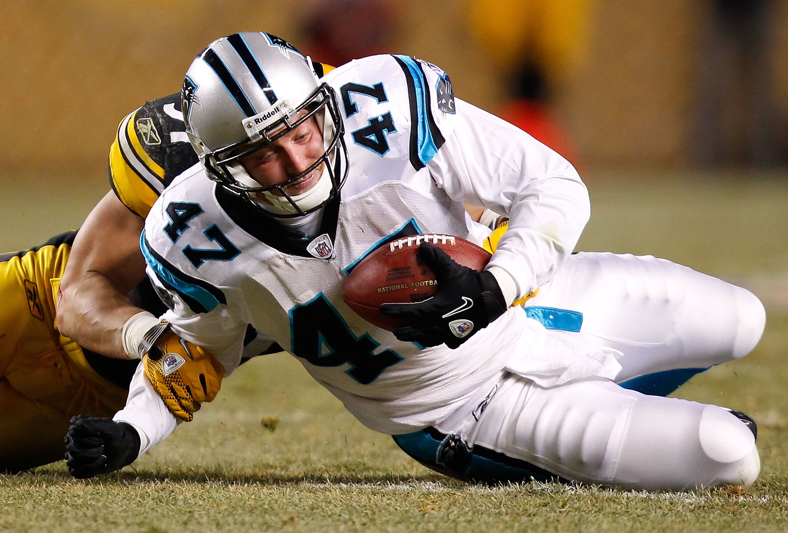 PITTSBURGH - DECEMBER 23:  Jeff King #47 of the Carolina Panthers is tackled after catching a pass during the game against the Pittsburgh Steelers on December 23, 2010 at Heinz Field in Pittsburgh, Pennsylvania.  (Photo by Jared Wickerham/Getty Images)