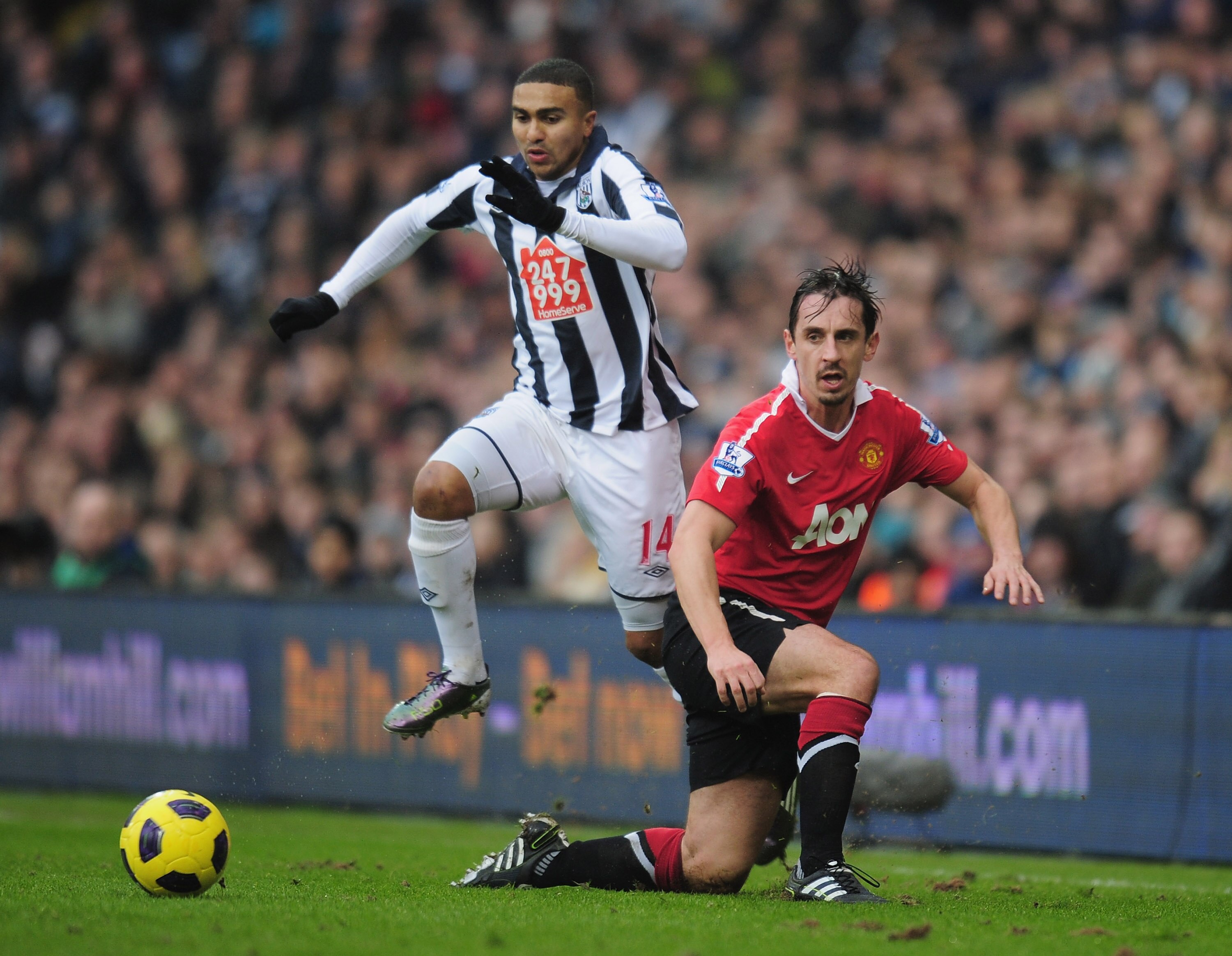 WEST BROMWICH, ENGLAND - JANUARY 01:  Jerome Thomas of West Bromich Albion is challenged by Gary Neville of Manchester United  during the Barclays Premier League match between West Bromich Albion and Manchester United at The Hawthorns on January 1, 2011 i