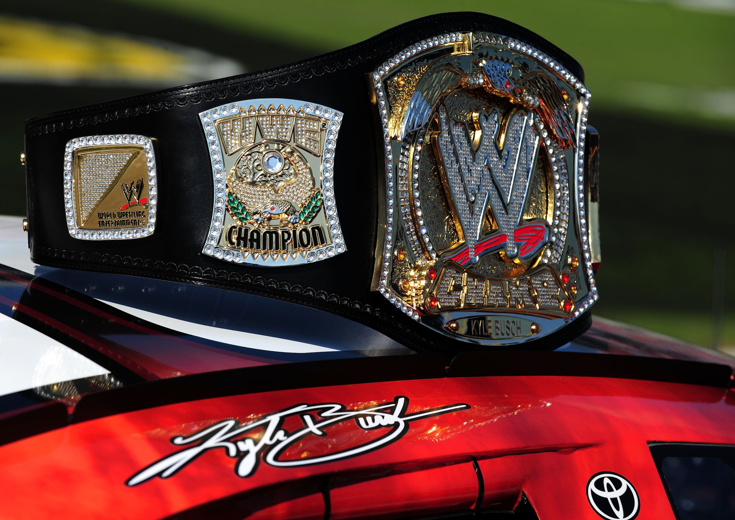 FORT WORTH, TX - NOVEMBER 07:  A replica of the WWE world championship belt rests on top of Kyle Busch's #18 Z-Line Designs/WWE Smackdown Toyota prior to the start of the NASCAR Nationwide Series O'Reilly Challenge at Texas Motor Speedway on November 7, 2