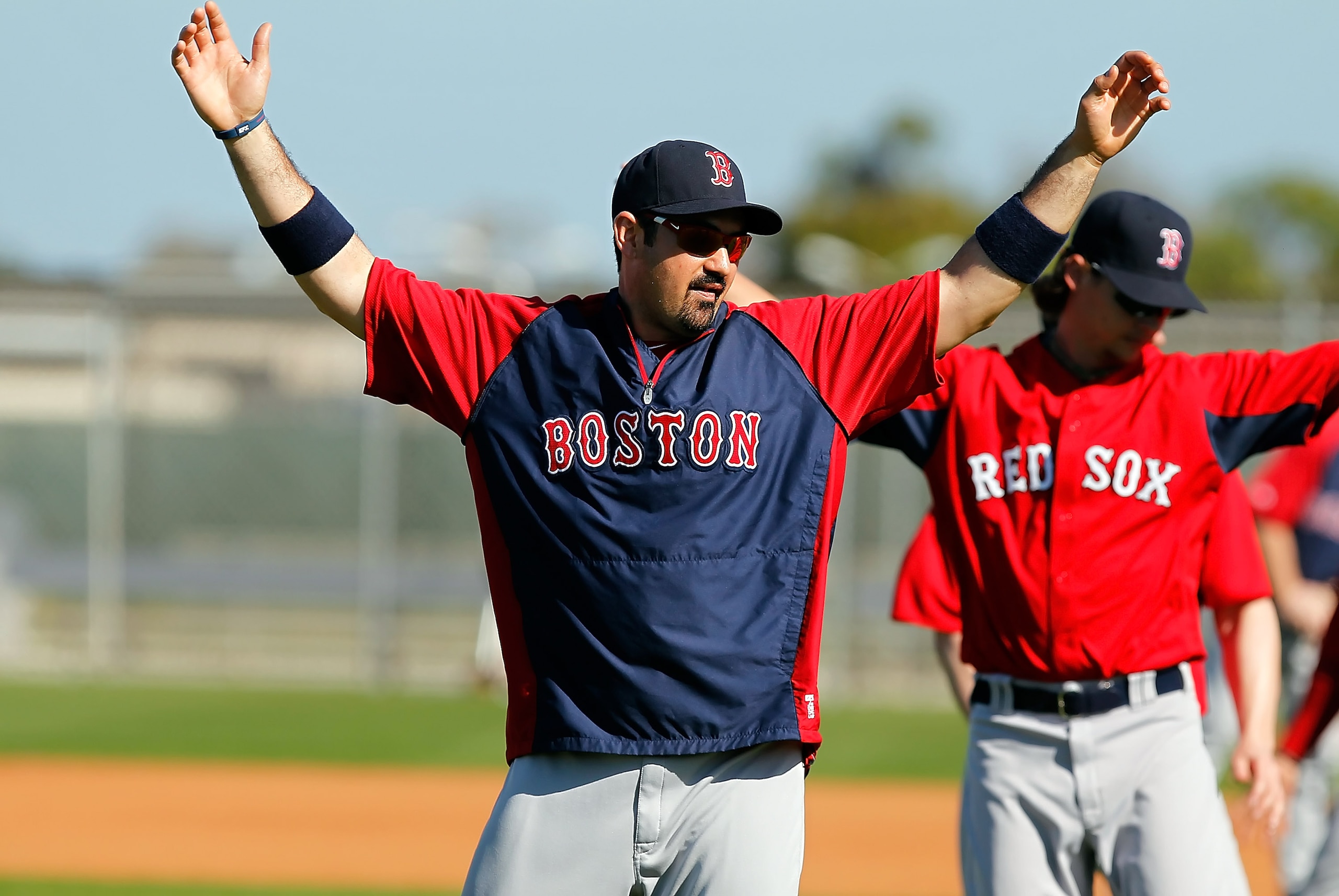 FORT MYERS, FL - FEBRUARY 19:  First baseman Adrian Gonzalez #28 of the Boston Red Sox stretches during a Spring Training Workout Session at the Red Sox Player Development Complex on February 19, 2011 in Fort Myers, Florida.  (Photo by J. Meric/Getty Imag