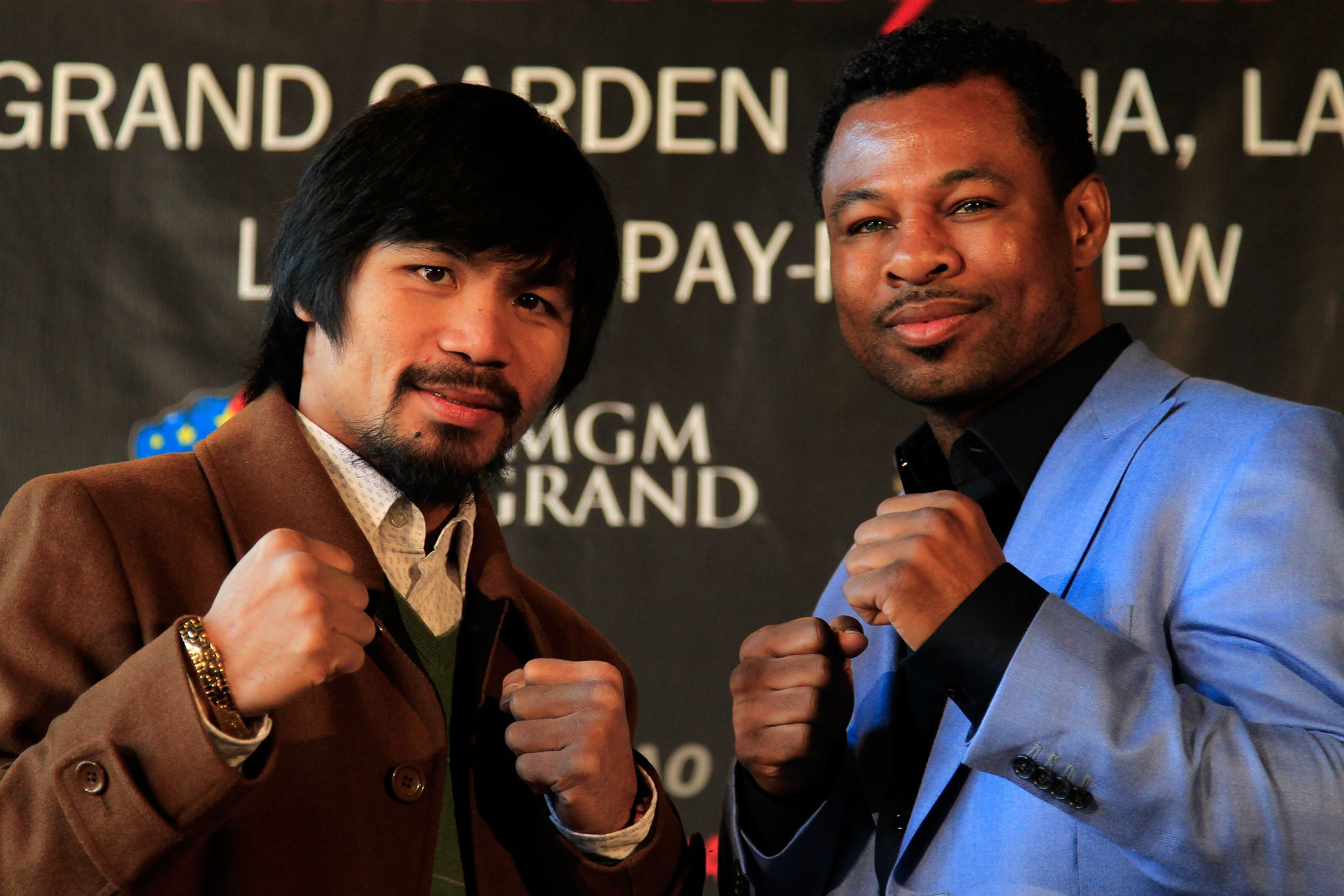 NEW YORK, NY - FEBRUARY 14:  Manny Pacquiao (L) and Shane Mosley pose for photographs to promote their upcoming fight at The Lighthouse at Chelsea Piers on February 14, 2011 in New York City.  (Photo by Chris Trotman/Getty Images)