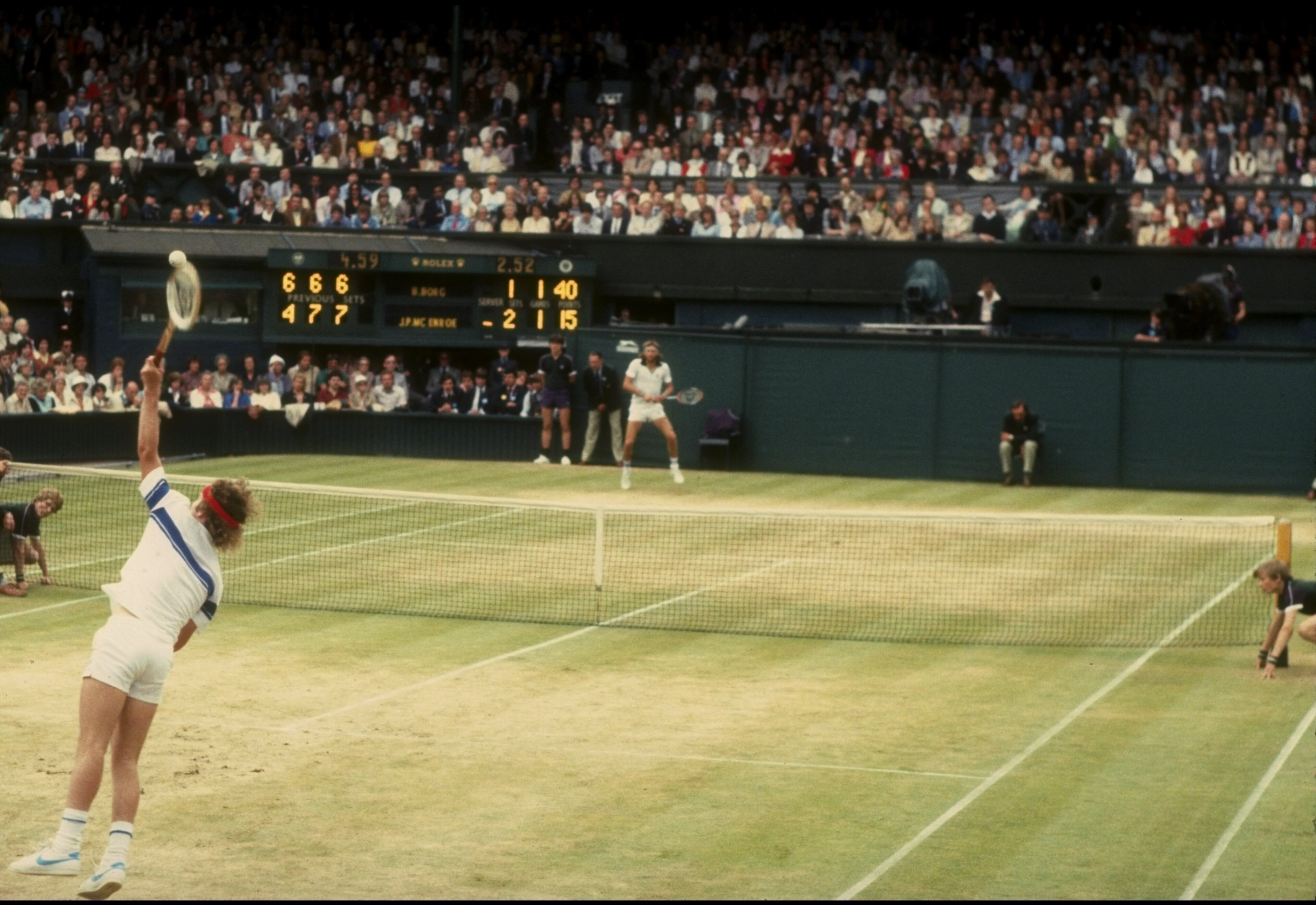 Jul 1981:  John McEnroe of the USA serves during his match against Bjorn Borg in the finals of the 1981 Lawn Tennis Championships at the All-England Club in Wimbledon, England.  McEnroe won the match 4-6, 7-6, 7-6, 6-4. Mandatory Credit: Tony Duffy  /Alls