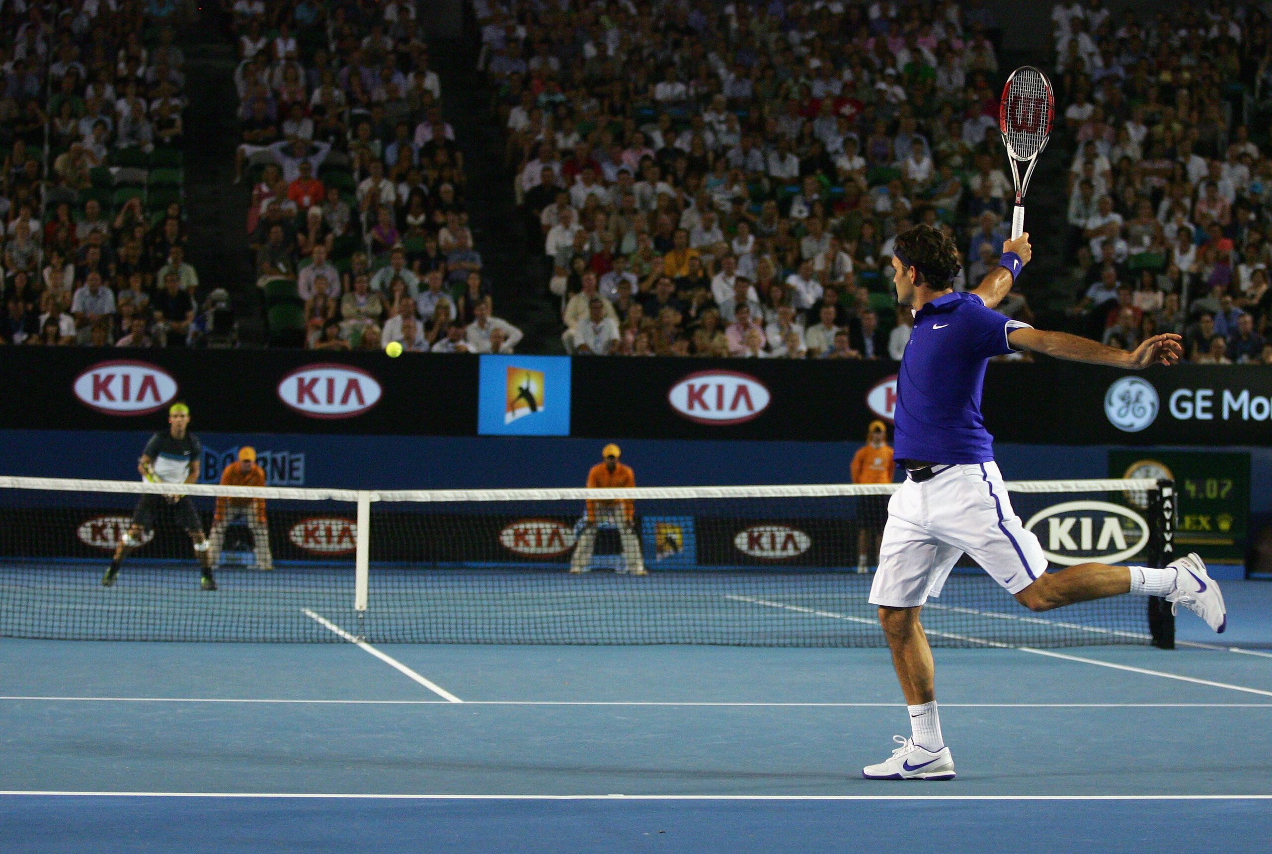 MELBOURNE, AUSTRALIA - FEBRUARY 01:  Roger Federer of Switzerland plays a backhand in his men's final match against Rafael Nadal of Spain during day fourteen of the 2009 Australian Open at Melbourne Park on  February 1, 2009 in Melbourne, Australia.  (Pho