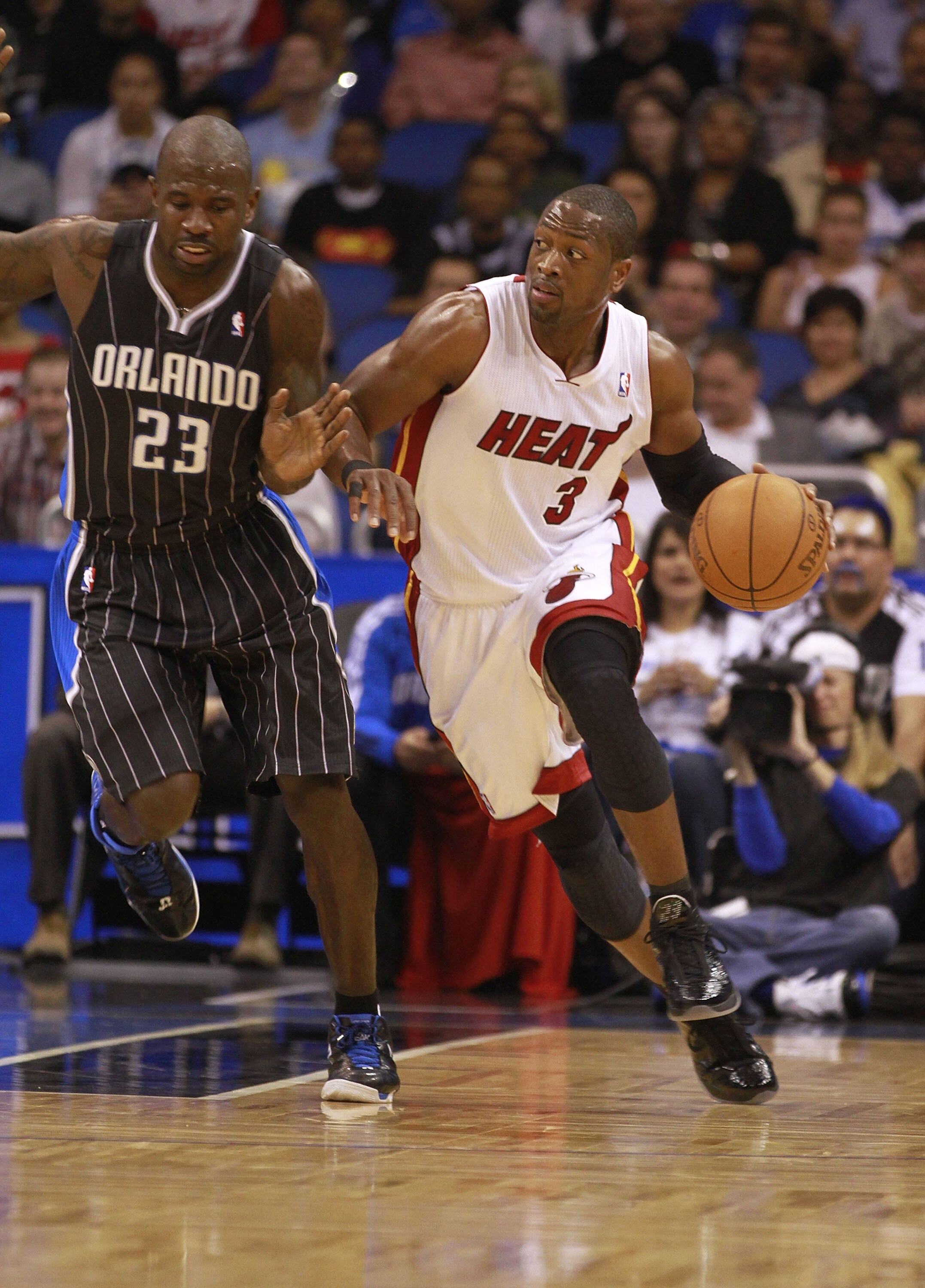 ORLANDO, FL - FEBRUARY 03:  Guard Dwyane Wade #3 of the Miami Heat drives against Guard Jason Richardson #23 of the Orlando Magic at Amway Arena on February 3, 2011 in Orlando, Florida. NOTE TO USER: User expressly acknowledges and agrees that, by downloa