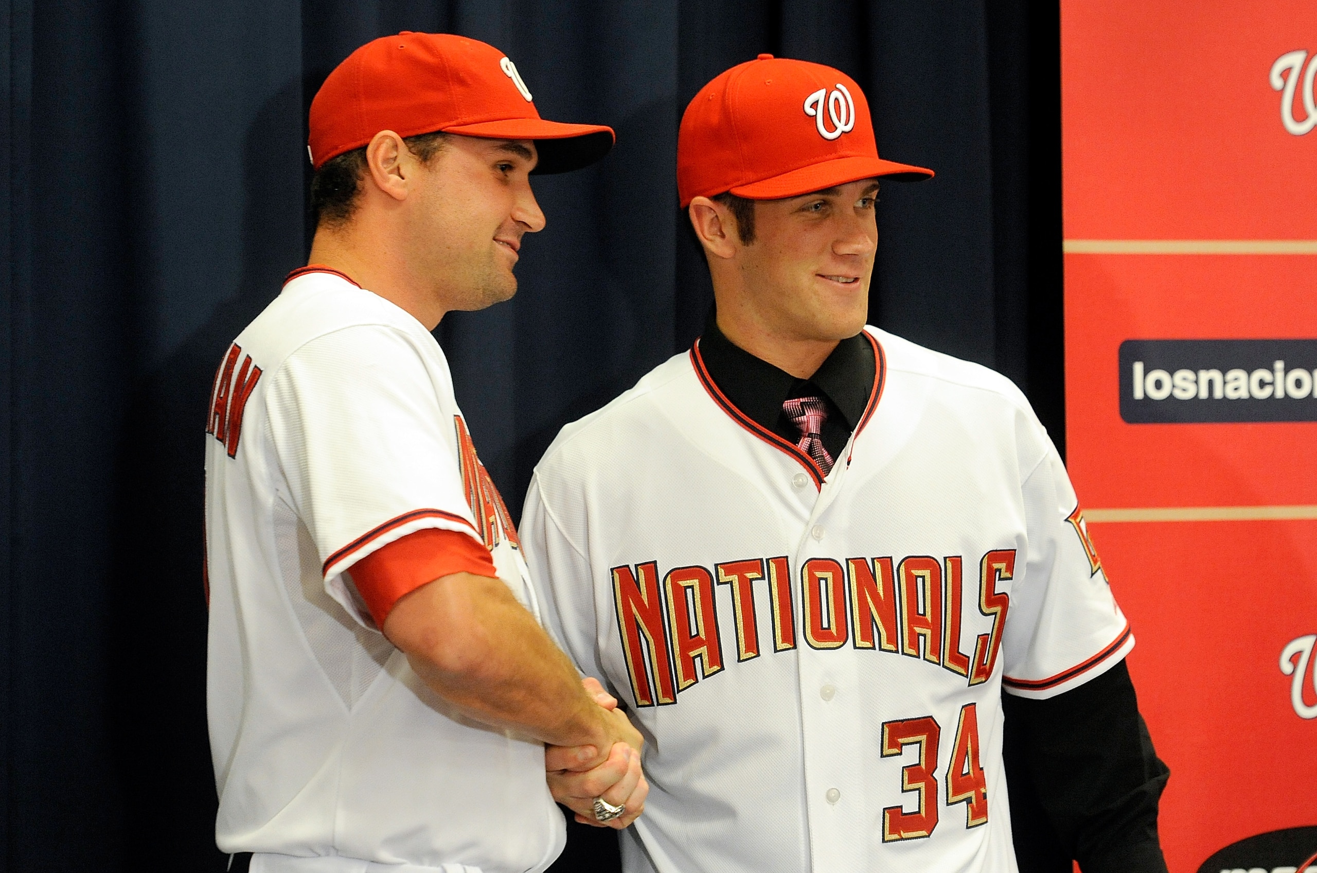 WASHINGTON - AUGUST 26:  Bryce Harper #34 and Ryan Zimmerman #11 of the Washington Nationals pose for pictures during a press conference at Nationals Park on August 26, 2010 in Washington, DC.  (Photo by Greg Fiume/Getty Images)