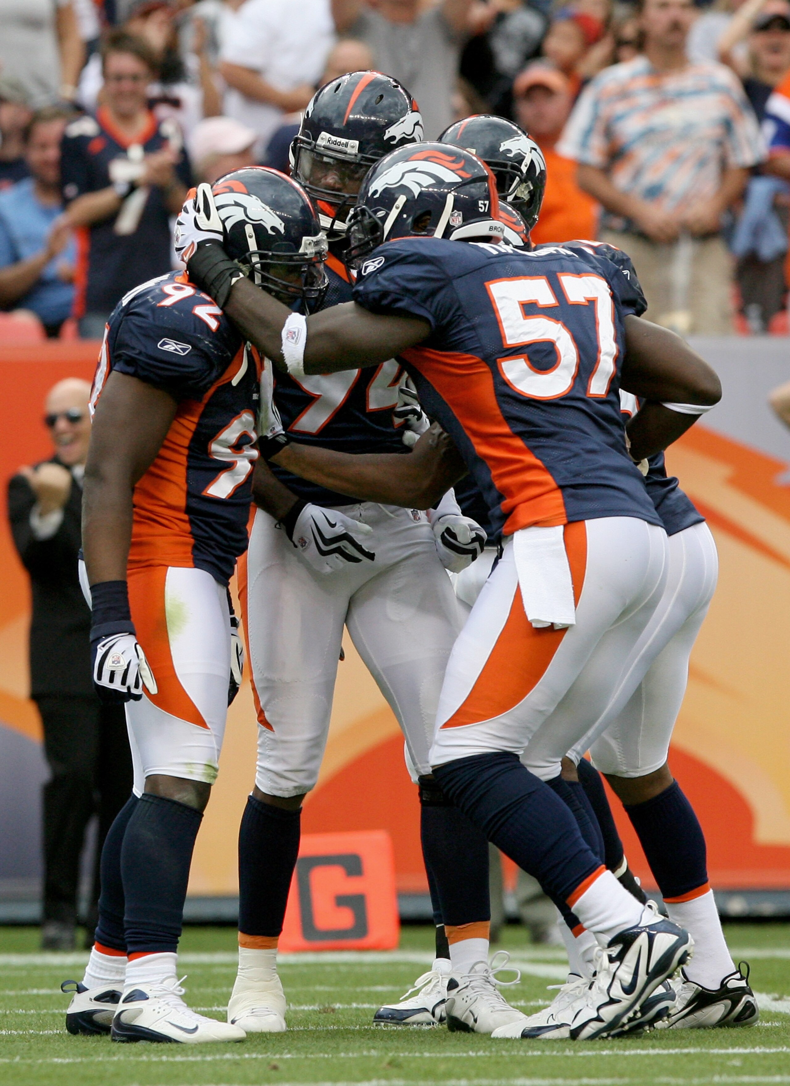DENVER - SEPTEMBER 20: Defensive end Elvis Dumervil #92 (L) of the Denver Broncos is congratulated by his teammates after he sacked quarterback Brady Quinn #10 of the Cleveland Browns in the fourth quarter during NFL action at Invesco Field at Mile High DENVER - SEPTEMBER 20: Defensive end Elvis Dumervil #92 (L) of the Denver Broncos is congratulated by his teammates after he sacked quarterback Brady Quinn #10 of the Cleveland Browns in the fourth quarter during NFL action at Invesco Field at Mile High