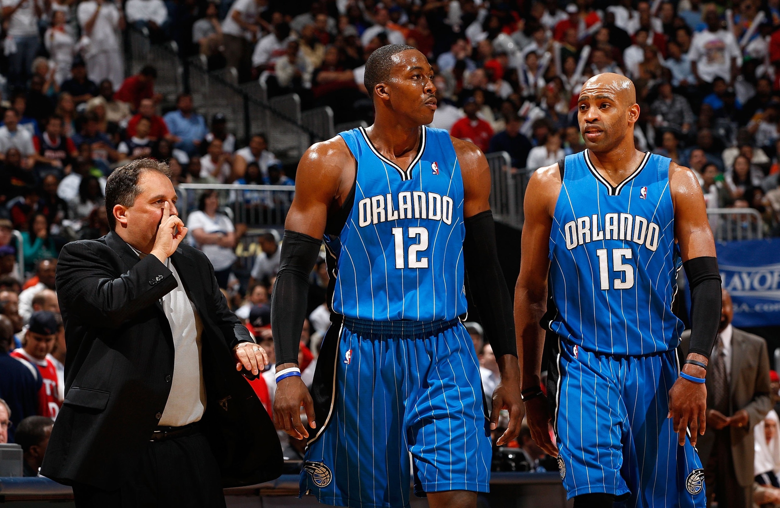 ATLANTA - MAY 10:  Head coach Stan Van Gundy, Dwight Howard #12 and Vince Carter #15 of the Orlando Magic against the Atlanta Hawks during Game Four of the Eastern Conference Semifinals of the 2010 NBA Playoffs at Philips Arena on May 10, 2010 in Atlanta,