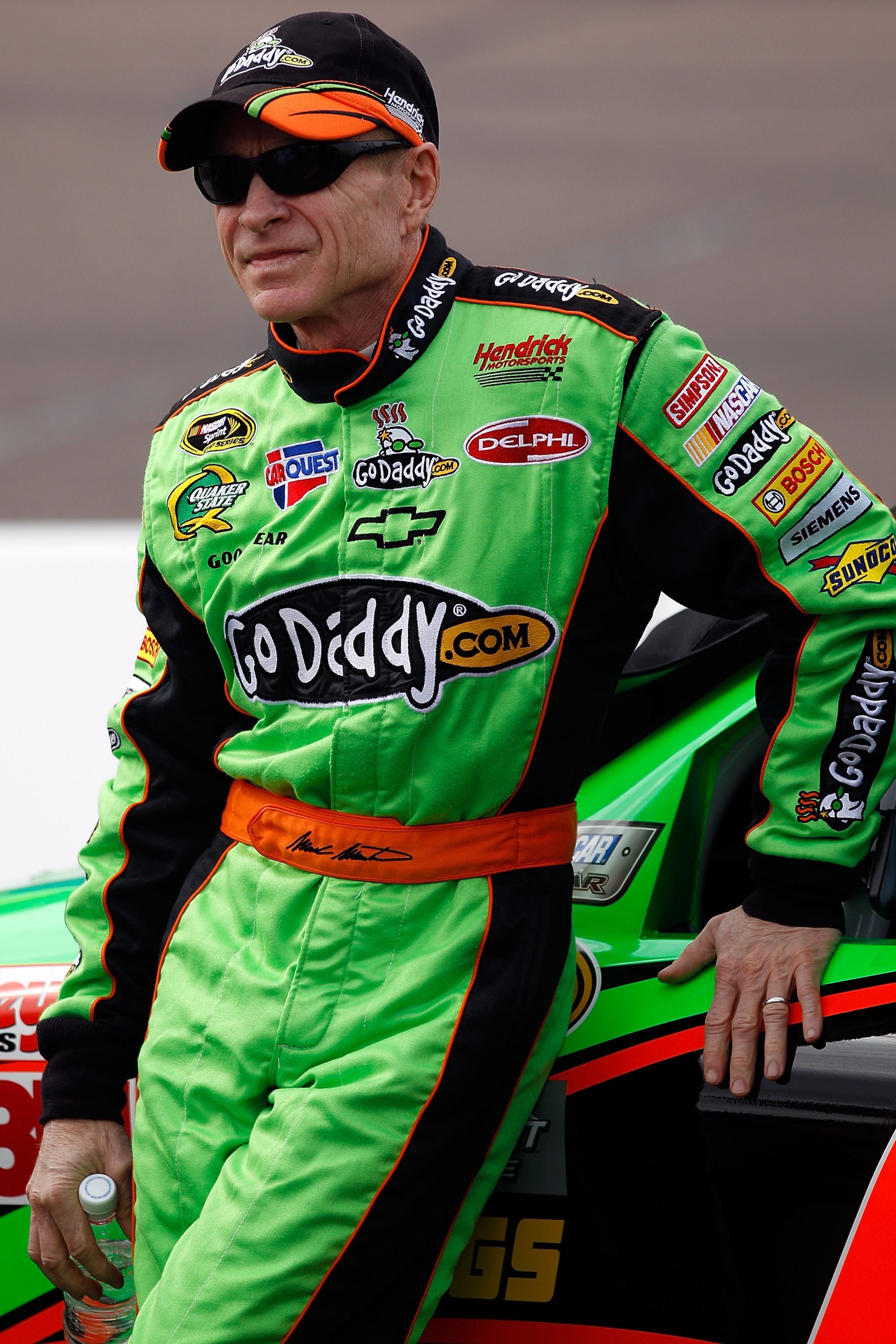 AVONDALE, AZ - FEBRUARY 26:  Mark Martin, driver of the #5 GoDaddy.com Chevrolet, stands on pit road during qualifying for the NASCAR Sprint Cup Series Subway Fresh Fit 500 at Phoenix International Raceway on February 26, 2011 in Avondale, Arizona.  (Phot