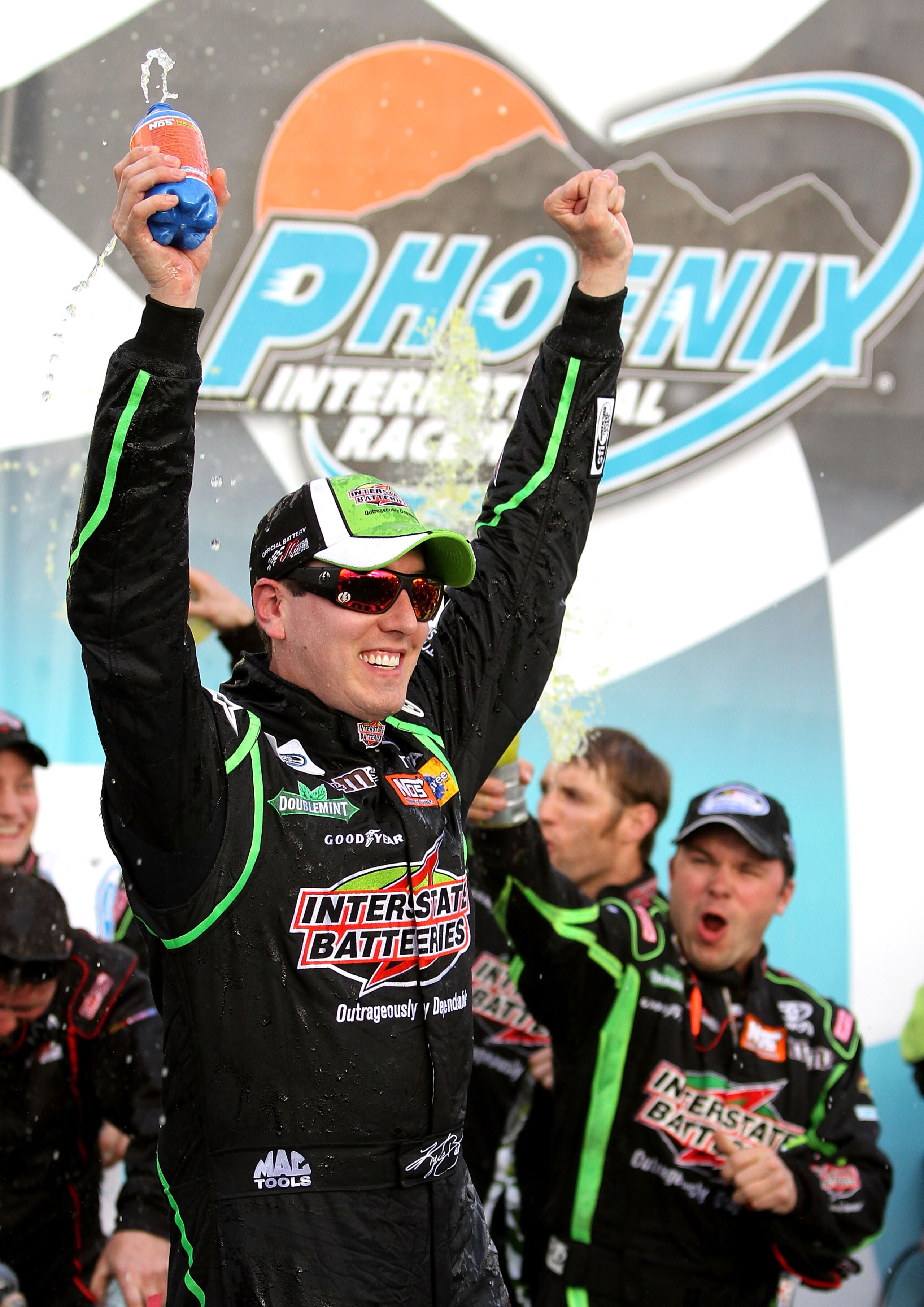 AVONDALE, AZ - FEBRUARY 26:  Kyle Busch, driver of the #18 Interstate Batteries Toyota, celebrates in victory lane after winning the NASCAR Nationwide Series Bashas' Supermarkets 200 at Phoenix International Raceway on February 26, 2011 in Avondale, Arizo