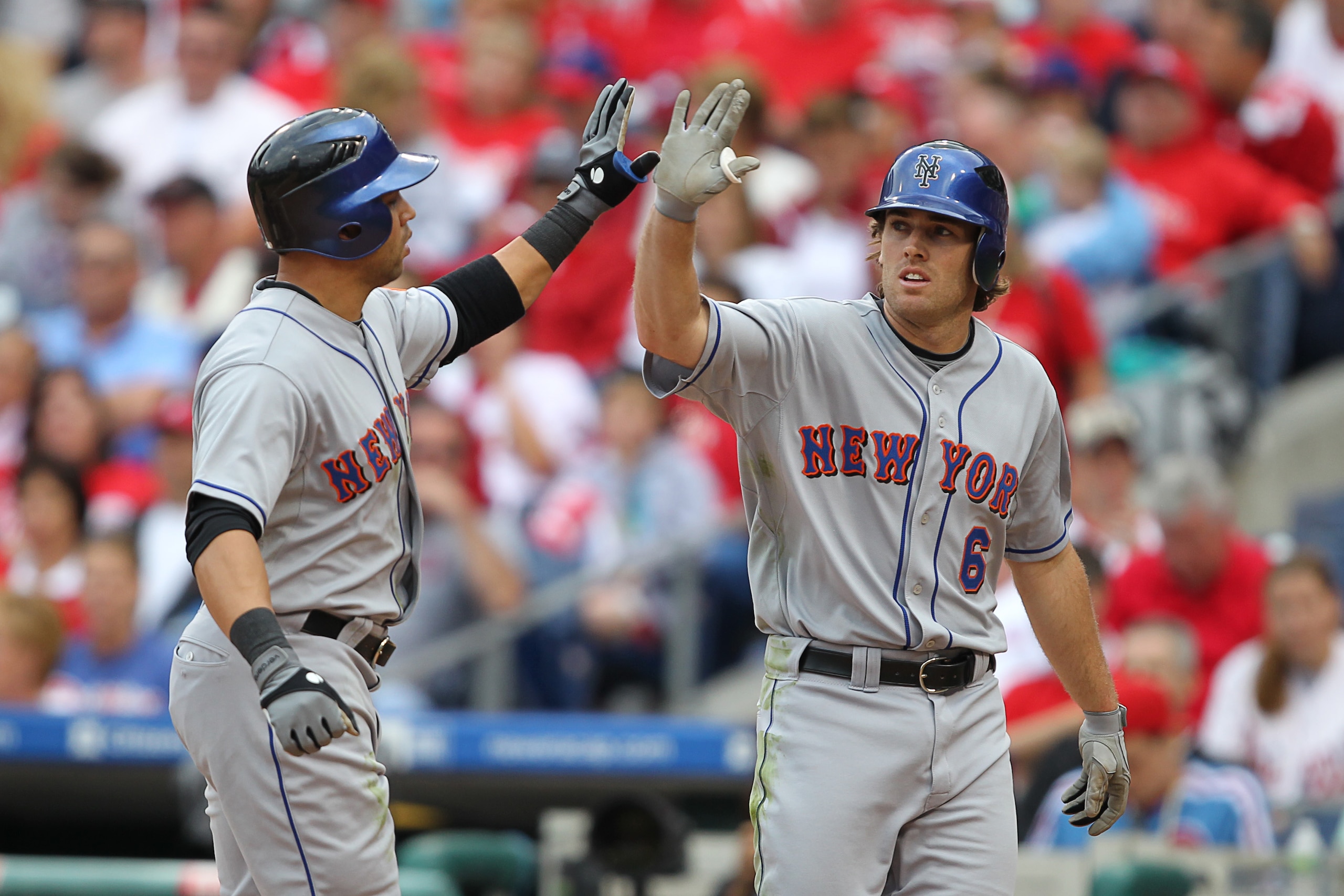 PHILADELPHIA - SEPTEMBER 26: Center fielder Carlos Beltran #15 of the New York Mets is greeted by left fielder Nick Evans #6 after hitting a two-run home run during a game against the Philadelphia Phillies at Citizens Bank Park on September 26, 2010 in Ph