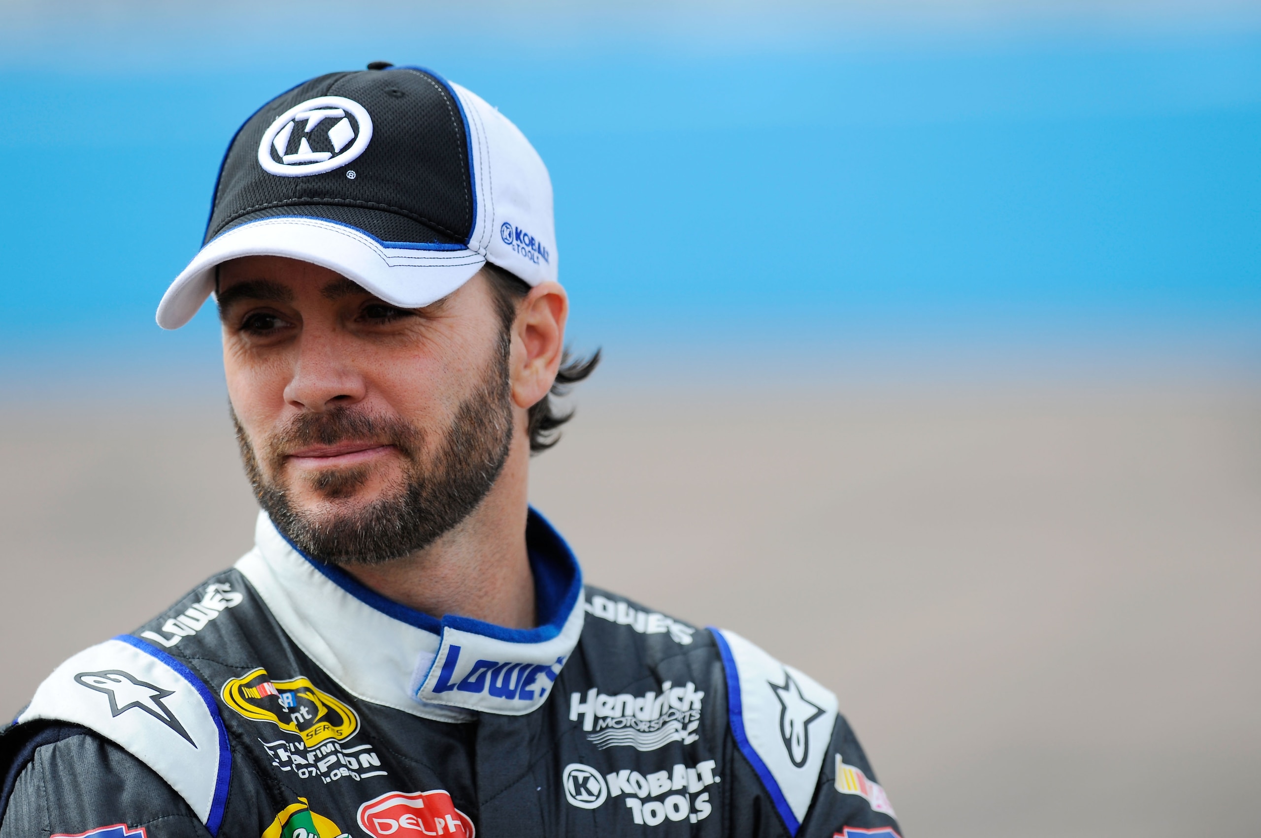AVONDALE, AZ - FEBRUARY 26:  Jimmie Johnson, driver of the #48 Lowe's Chevrolet, stands on pit road during qualifying for the NASCAR Sprint Cup Series Subway Fresh Fit 500 at Phoenix International Raceway on February 26, 2011 in Avondale, Arizona.  (Photo