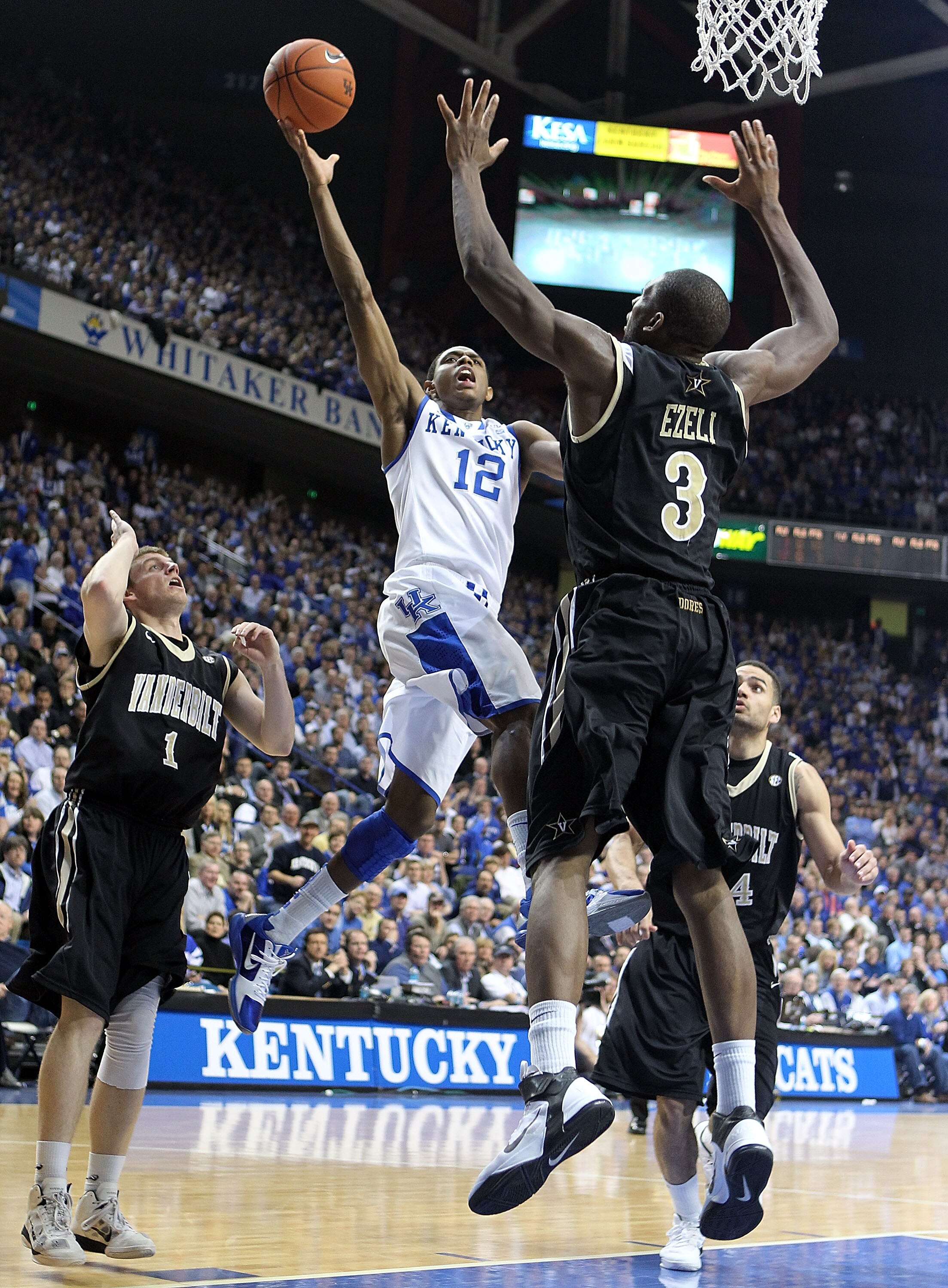 LEXINGTON, KY - MARCH 01:  Brandon Knight #12 of the Kentucky Wildcats shoots the ball while defended by Festus Ezeli #3 of the Vanderbilt Commodores  during the Kentucky 68-66 win in the SEC game at Rupp Arena on March 1, 2011 in Lexington, Kentucky.  (P