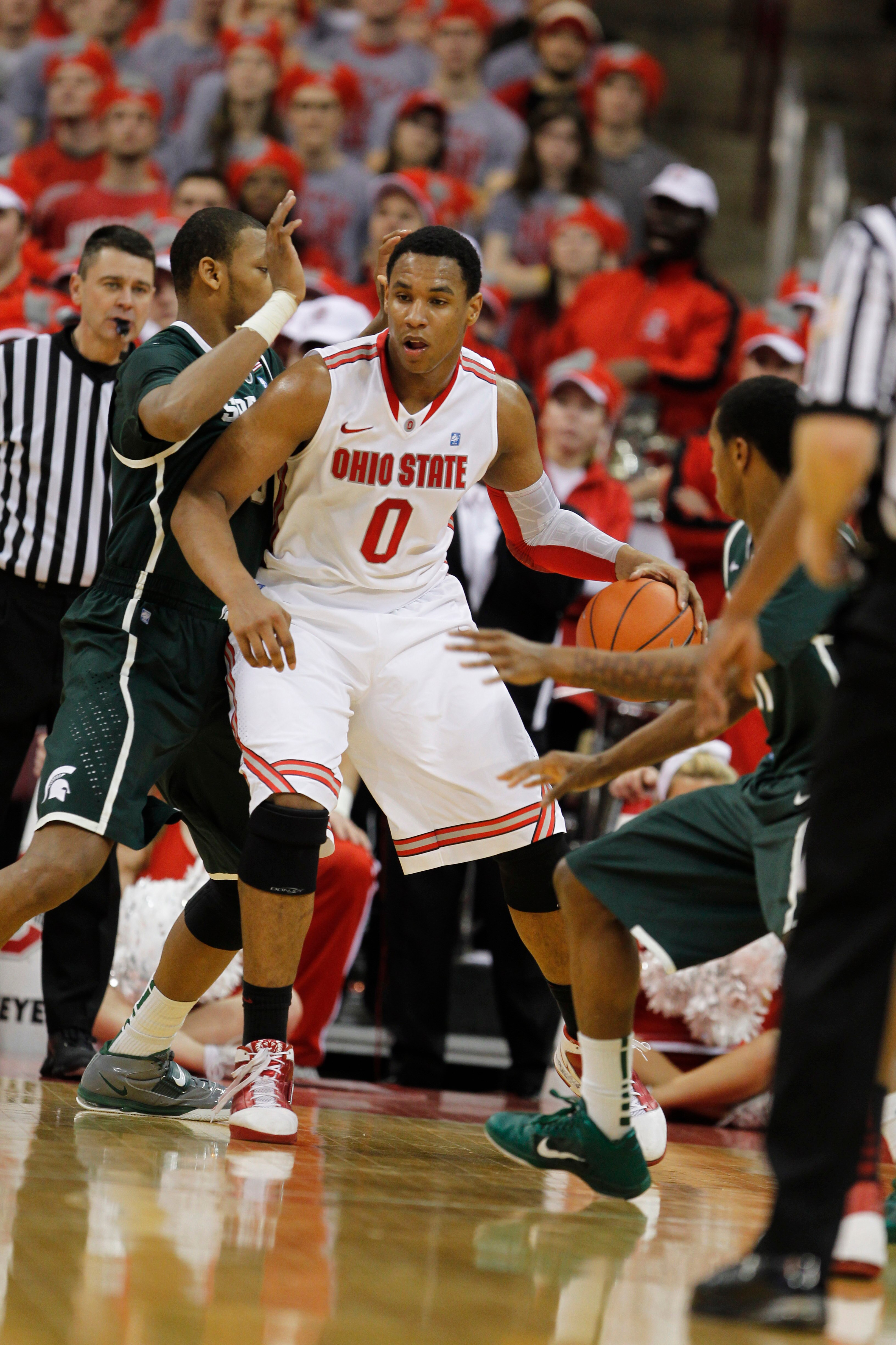 COLUMBUS, OH - FEBRUARY 15:  Jared Sullinger #0 of the Ohio State Buckeyes controls the ball while playing the Michigan State Spartans on February 15, 2011 at Value City Arena in Columbus, Ohio.  (Photo by Gregory Shamus/Getty Images)