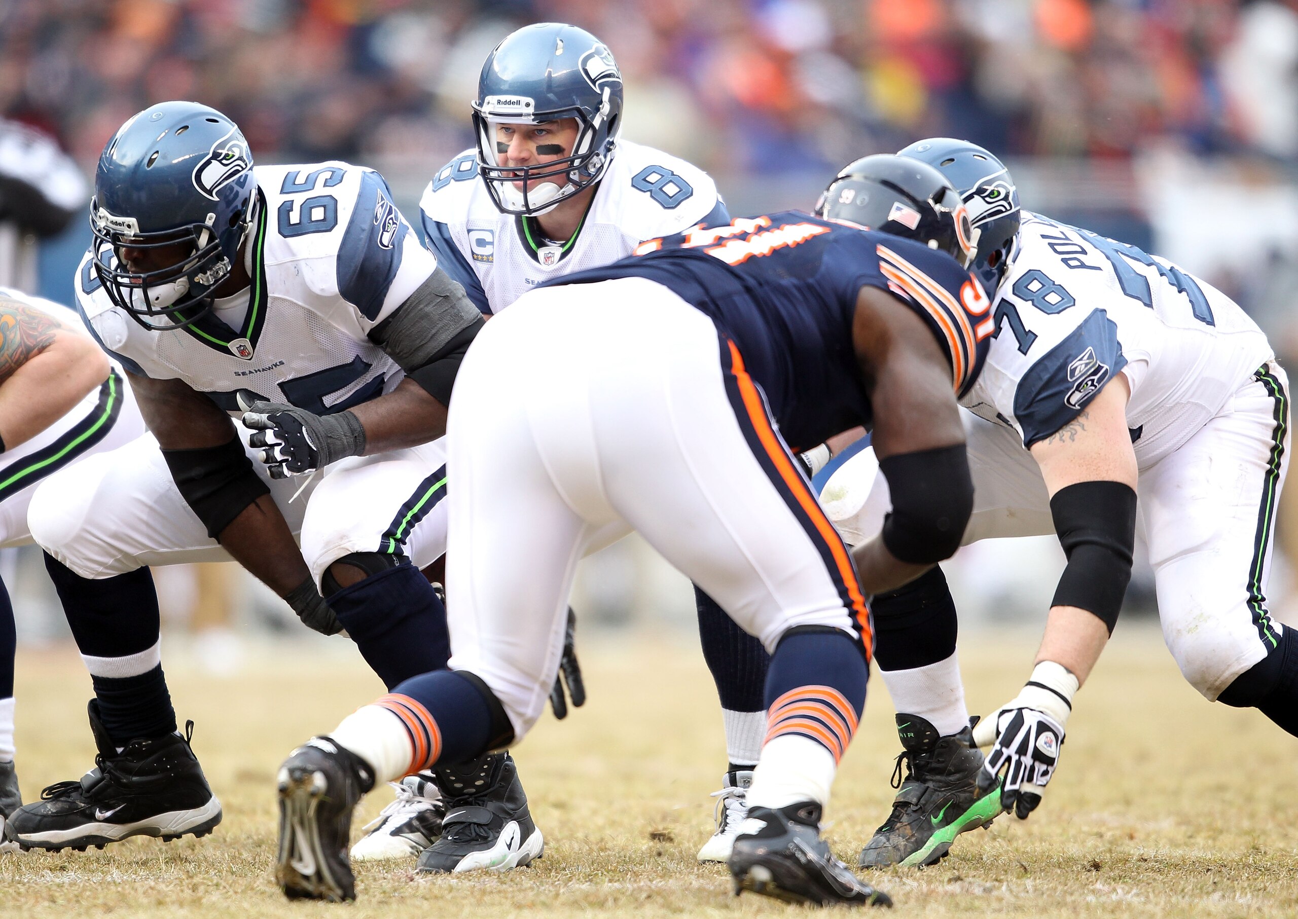 CHICAGO, IL - JANUARY 16:  Quarterback Matt Hasselbeck #8 of the Seattle Seahawks under center against the Chicago Bears in the 2011 NFC divisional playoff game at Soldier Field on January 16, 2011 in Chicago, Illinois.  (Photo by Andy Lyons/Getty Images)