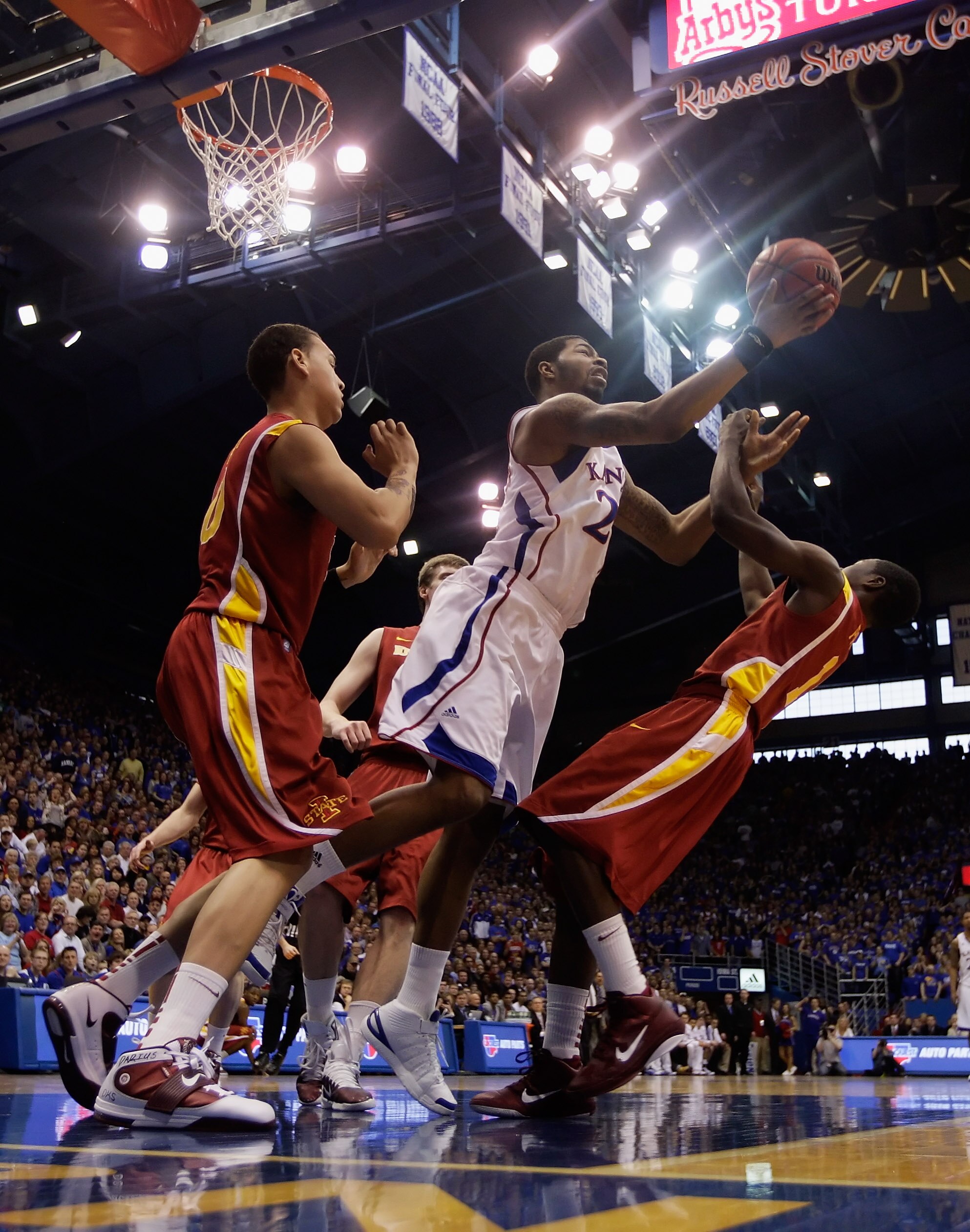 LAWRENCE, KS - FEBRUARY 12:  Marcus Morris #22 of the Kansas Jayhawks grabs a rebound during the game against the Iowa State Cyclones on February 12, 2011 at Allen Fieldhouse in Lawrence, Kansas.  (Photo by Jamie Squire/Getty Images)