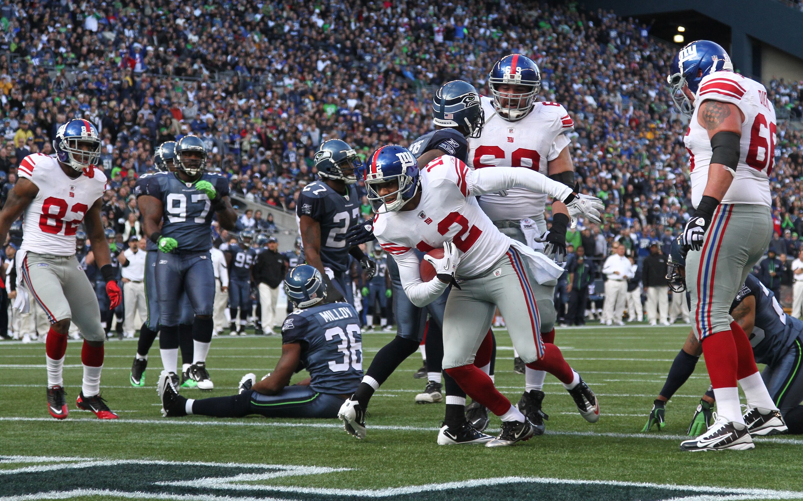 SEATTLE - NOVEMBER 07:  Wide receiver Steve Smith #12 of the New York Giants scores a touchdown against the Seattle Seahawks at Qwest Field on November 7, 2010 in Seattle, Washington. The Giants defeated the Seahawks 41-7. (Photo by Otto Greule Jr/Getty I